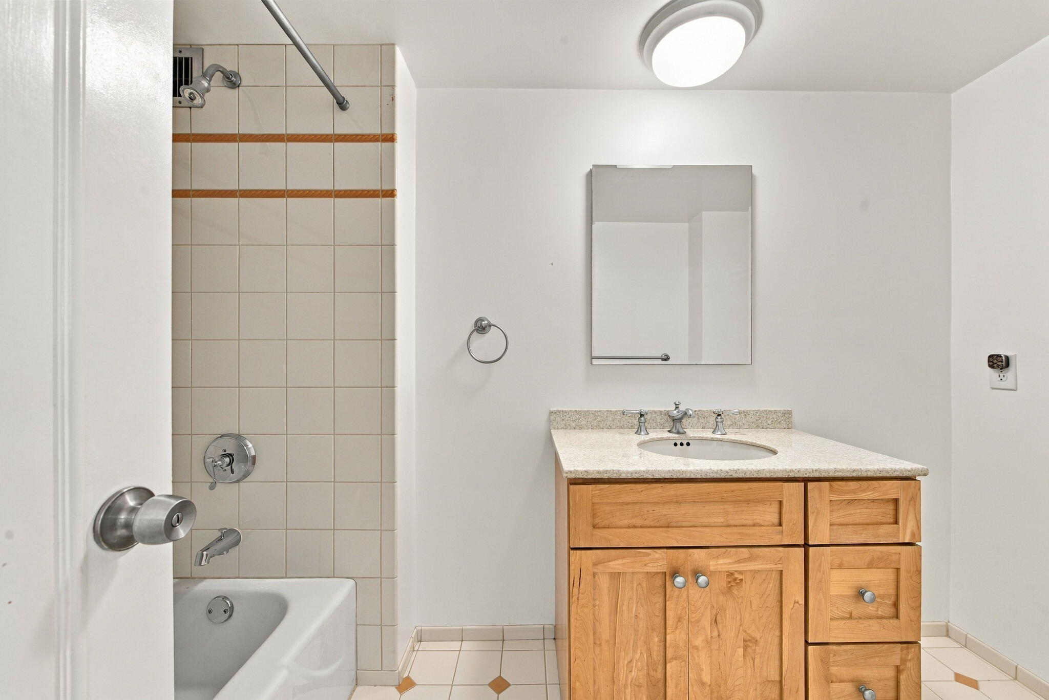 2ND FULL BATH WITH TUB AND SHOWER COMBO ACROSS HALLWAY FROM GUEST BEDROOM