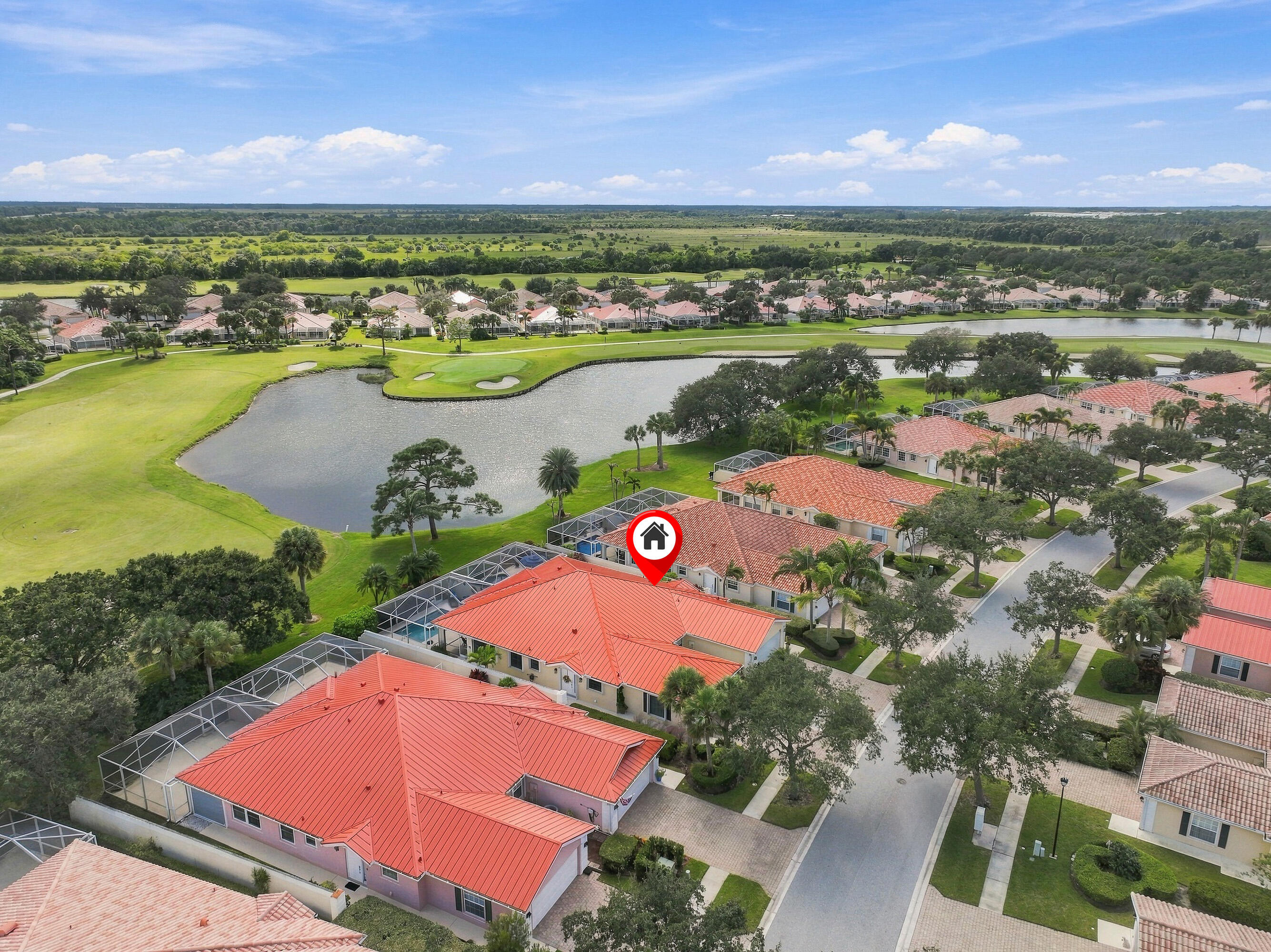 Aerial with lake and golf course views
