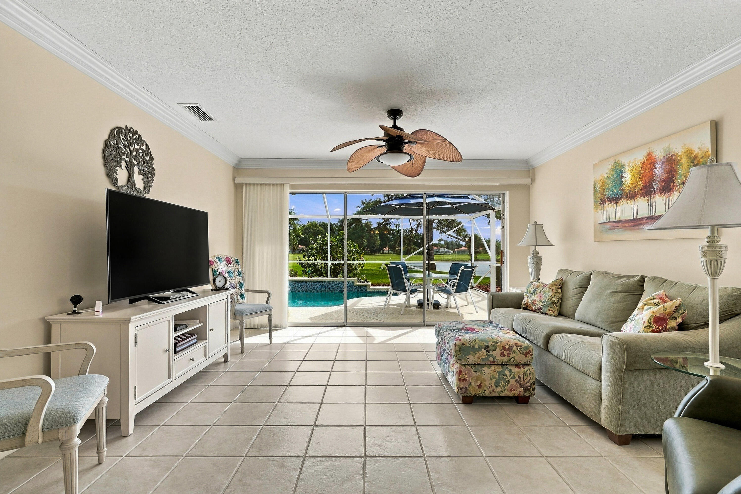 Living room with pool and lake views