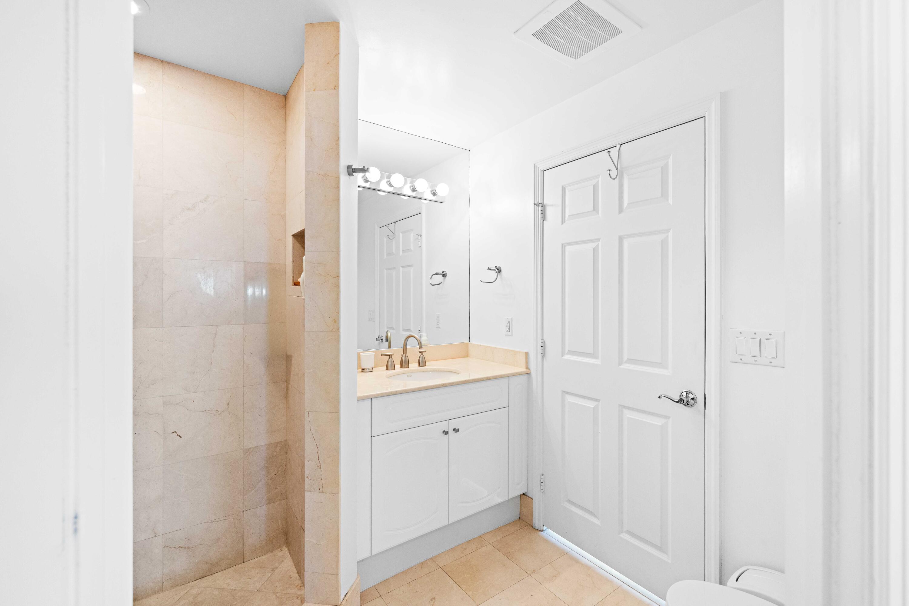 Bath accessible from bedroom 2 and/hallway