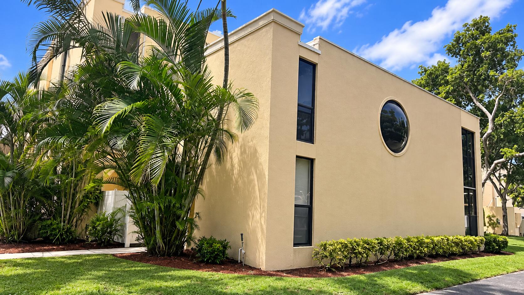 Modern Beige Condo with Tropical Landsca