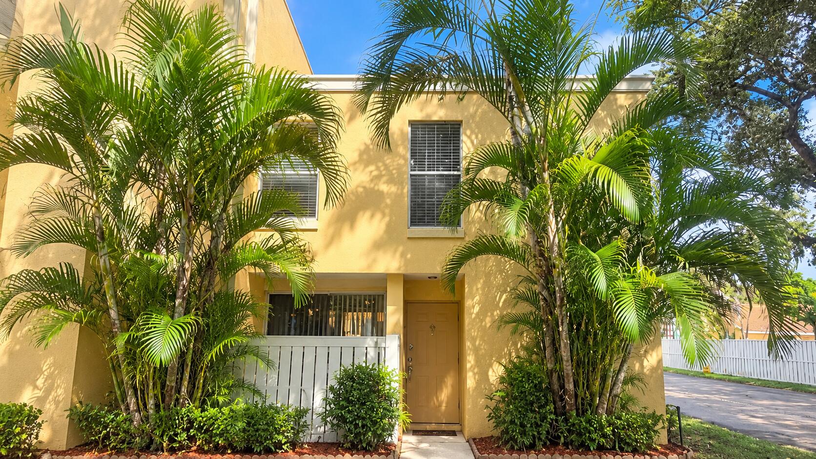 Sunlit Tropical Townhouse Entrance