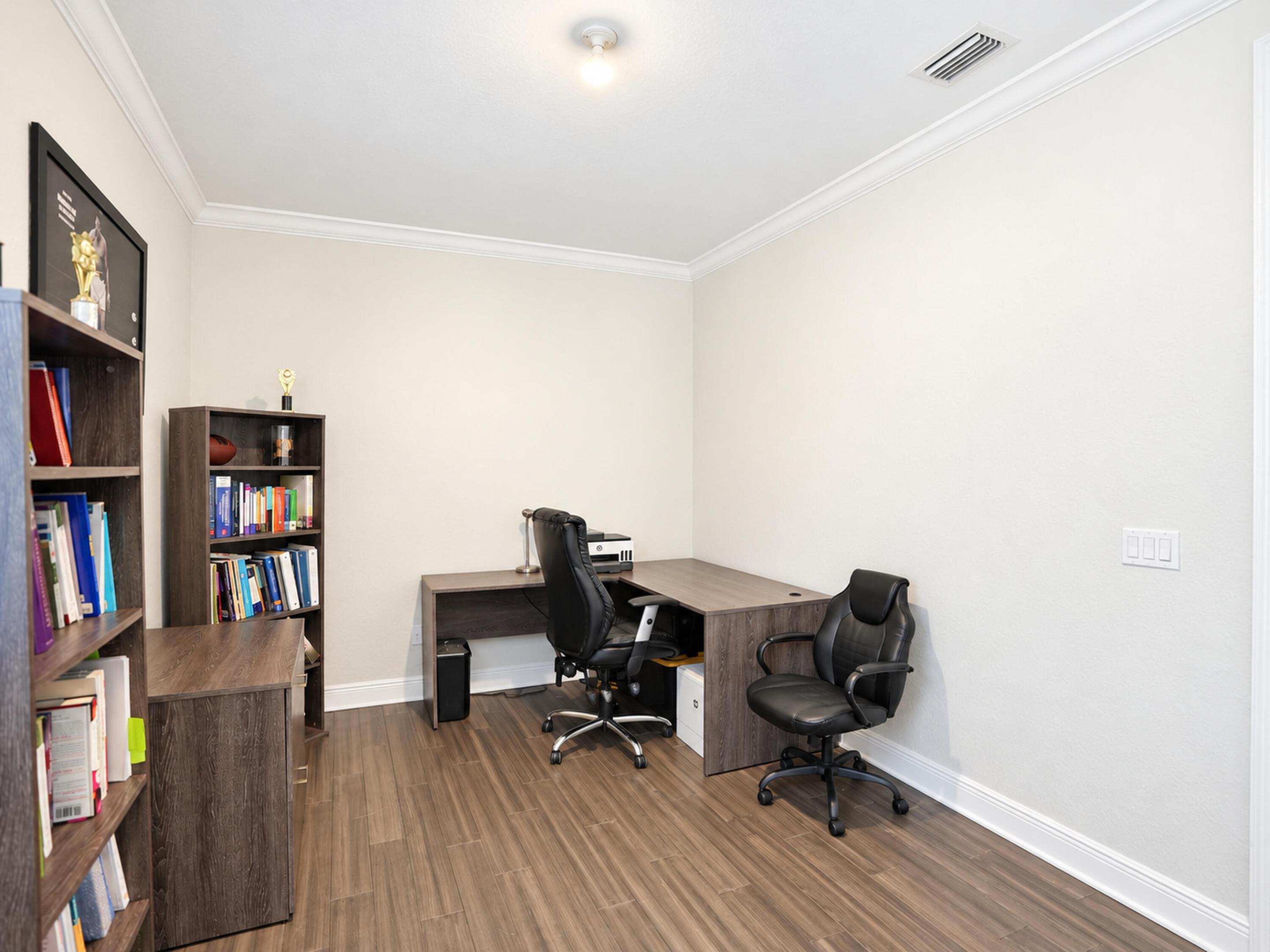 Neutral wall finishes, crown molding, and wood-finish flooring