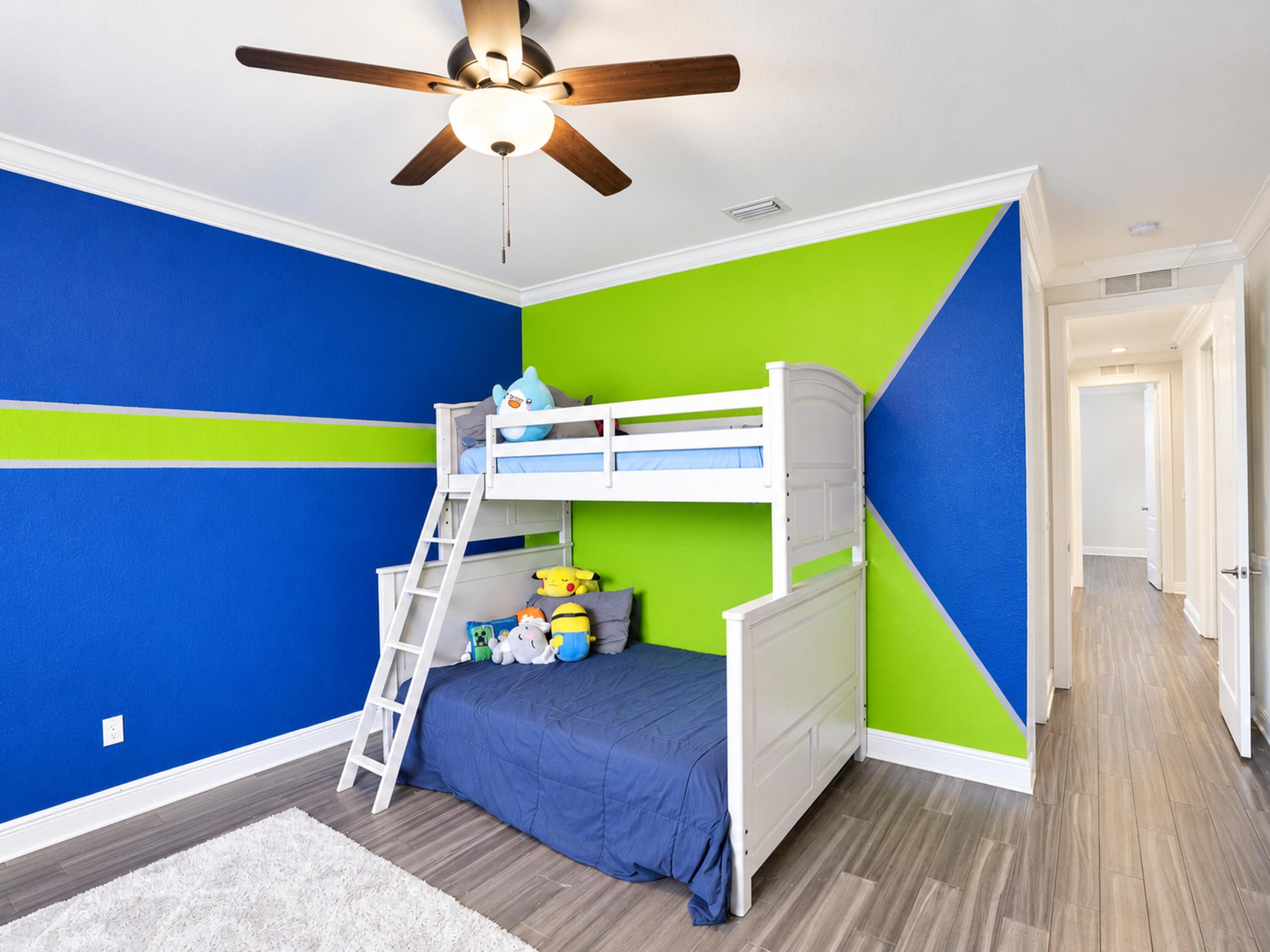 Wood-finish flooring, crown molding, and a ceiling fan with integrated lighting