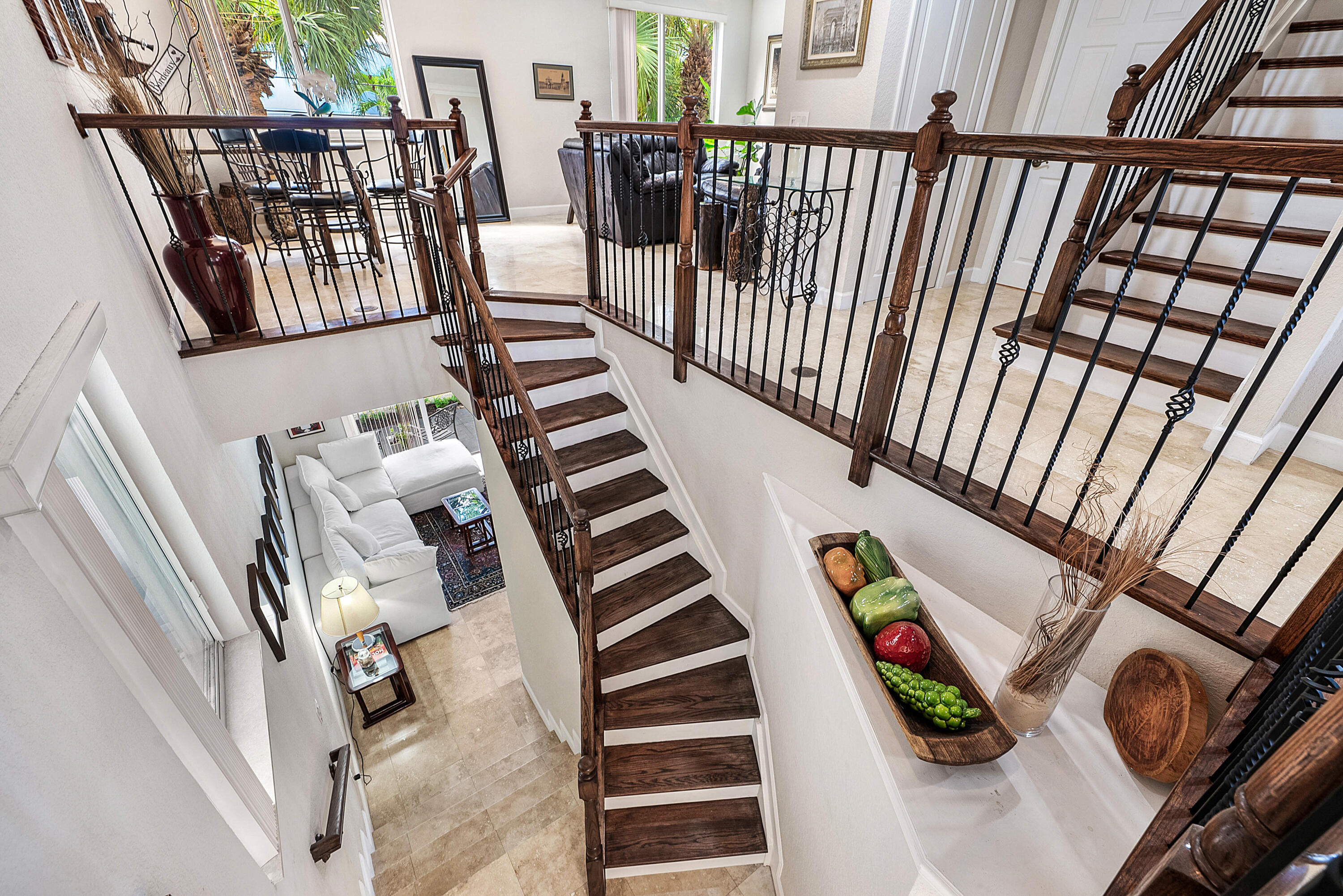 Head upstairs to your main living room, multiple dining areas, kitchen and powder room