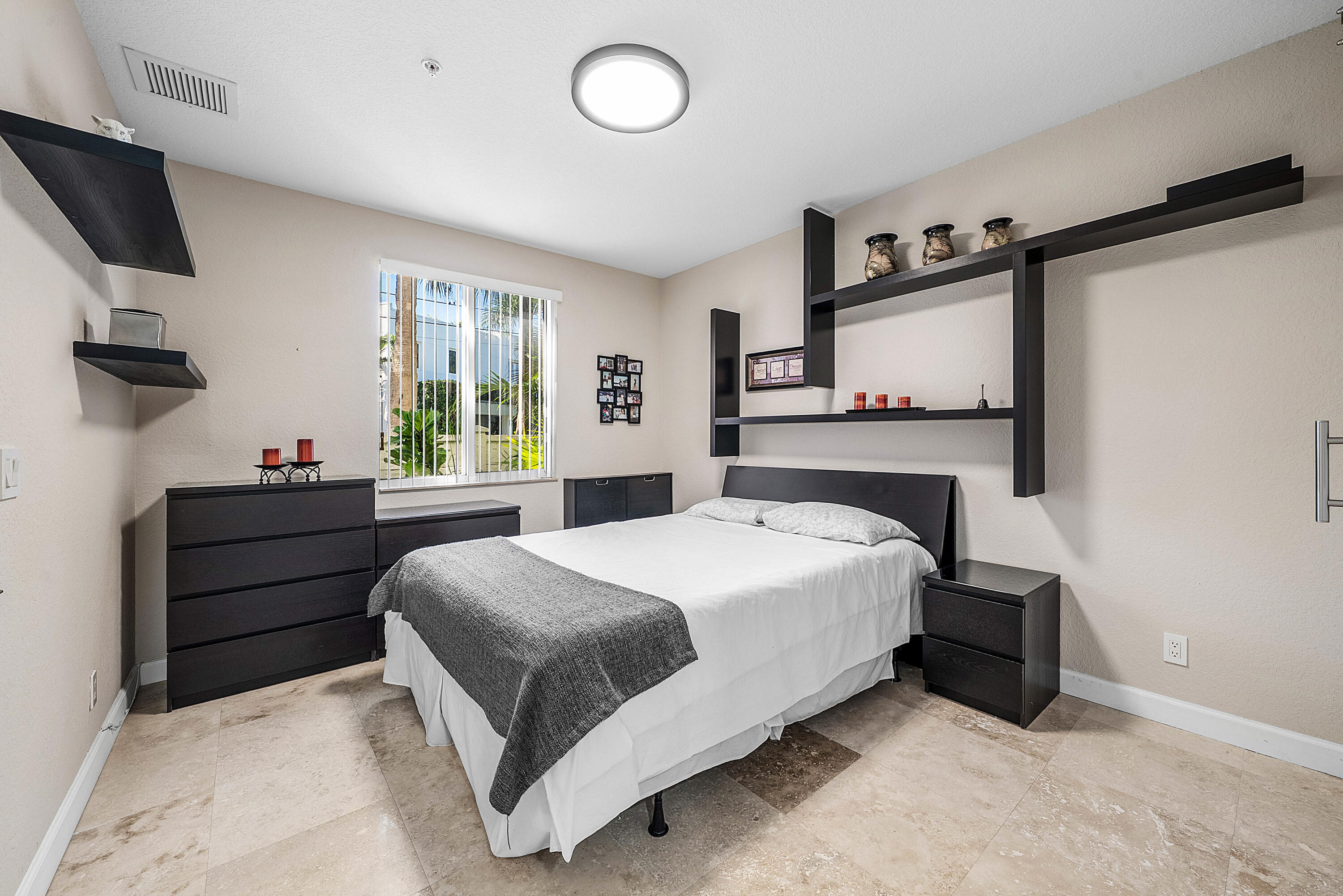 En-suite bedroom with full bath and walk-in closet with barn door