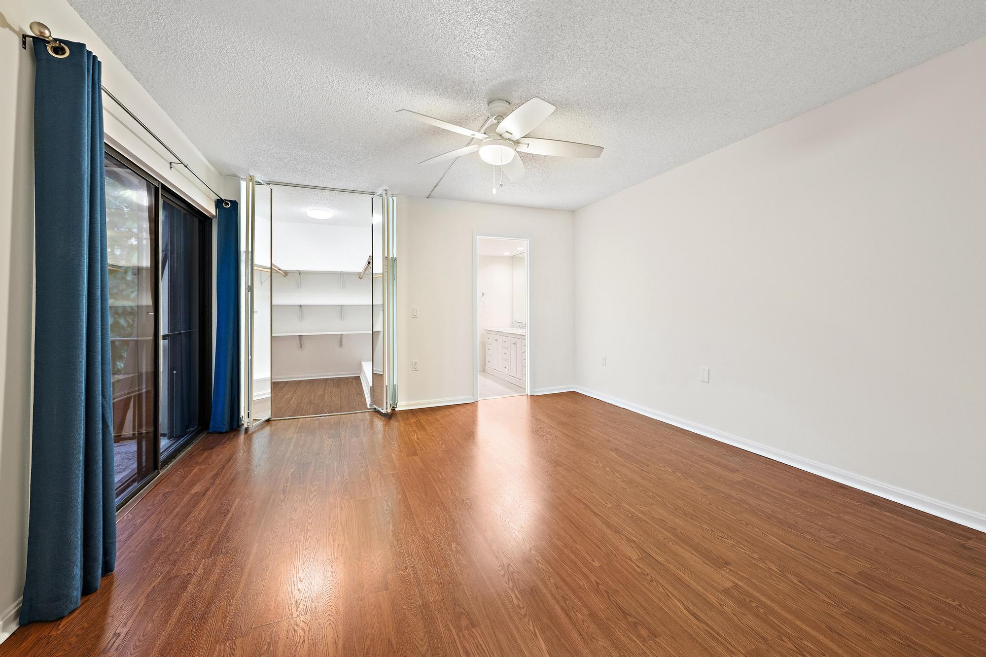 Primary bedroom with walk in closet open