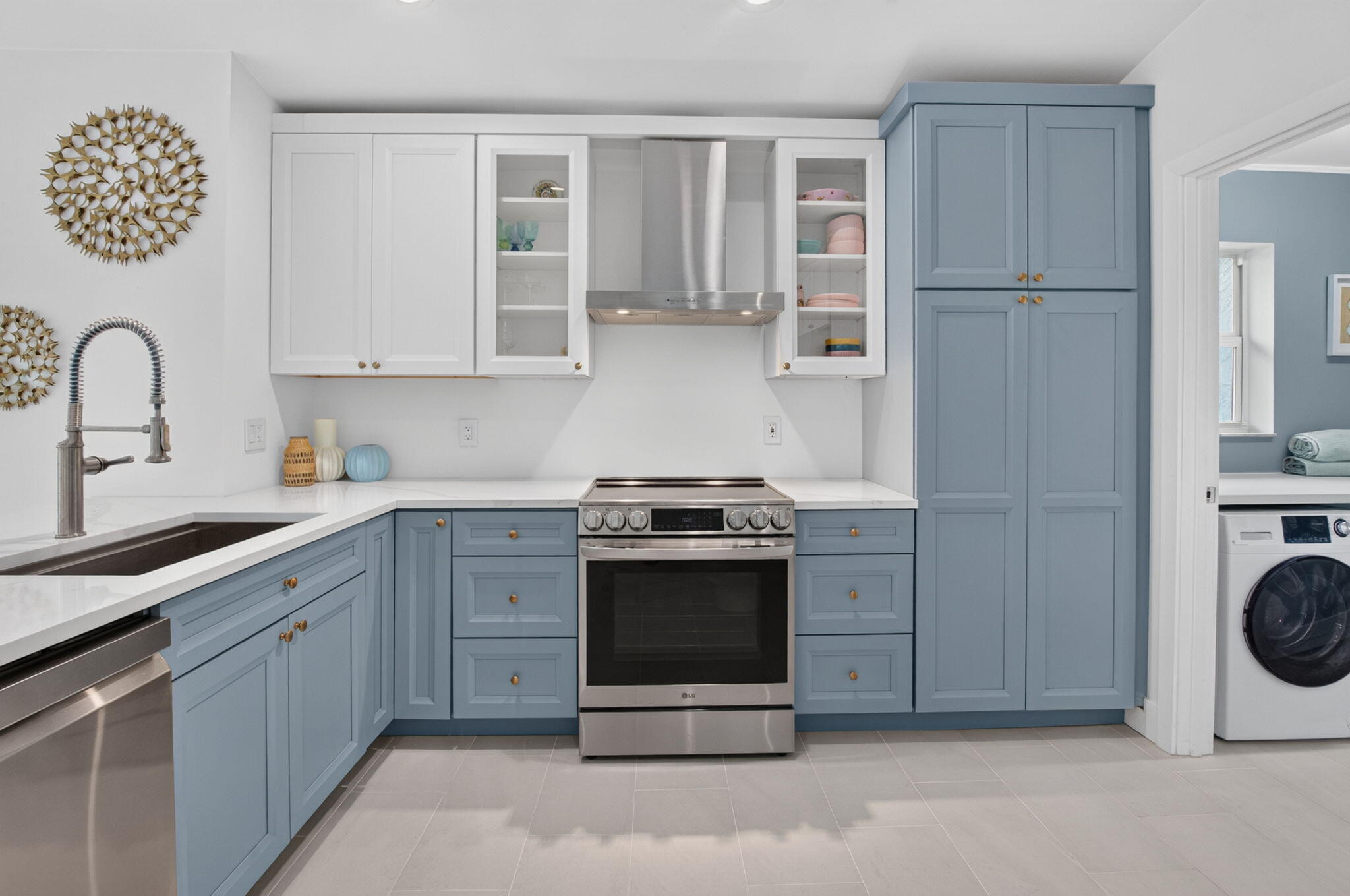 Glass cabintry, hood vent, stainless steel undermount kitchen sink, new faucets and hardware