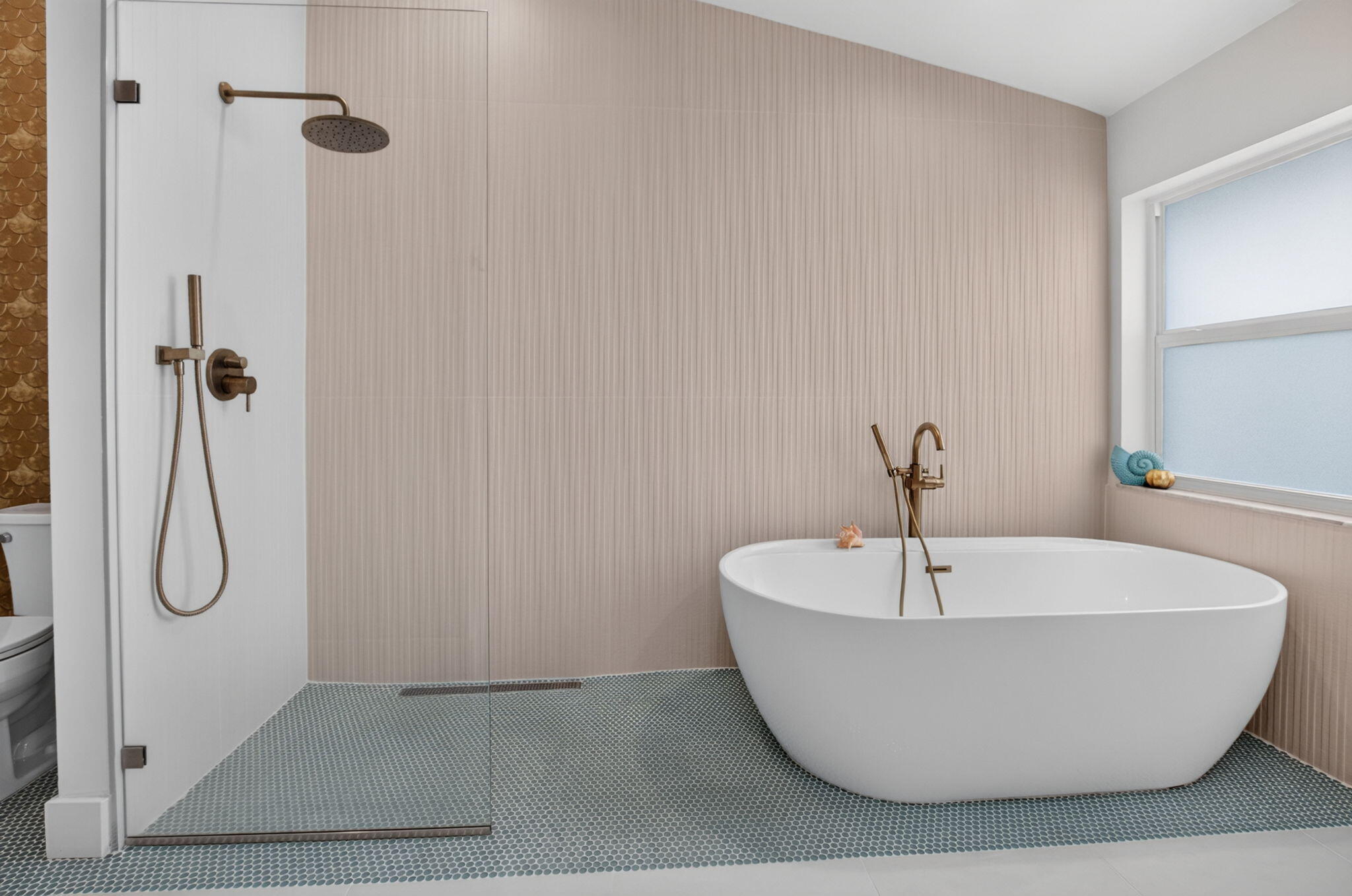 Frameless glass, freestanding tub, upgraded tile