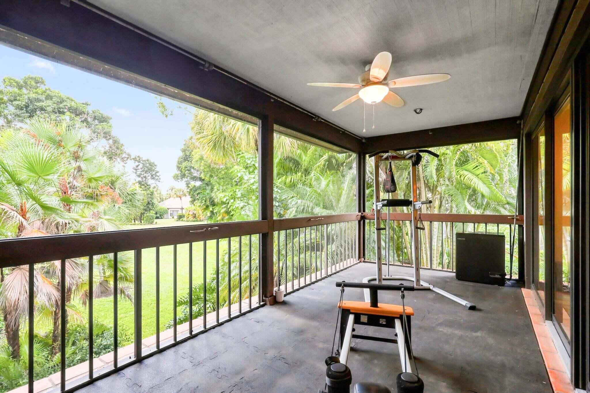 Screened patio overlooking tropical landscaping