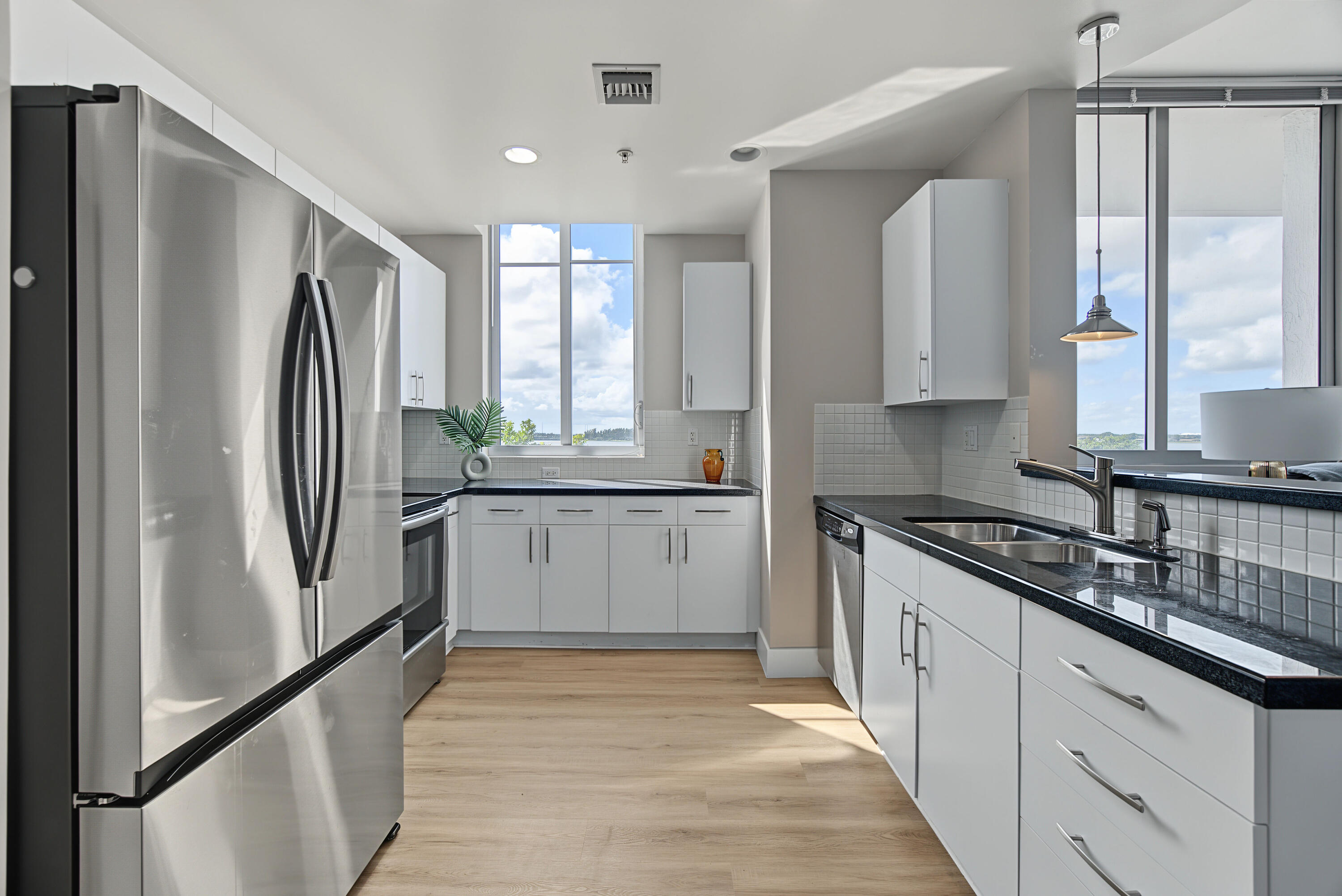 spacious open kitchen overlooking lake view. spacious open kitchen overlooking lake view.