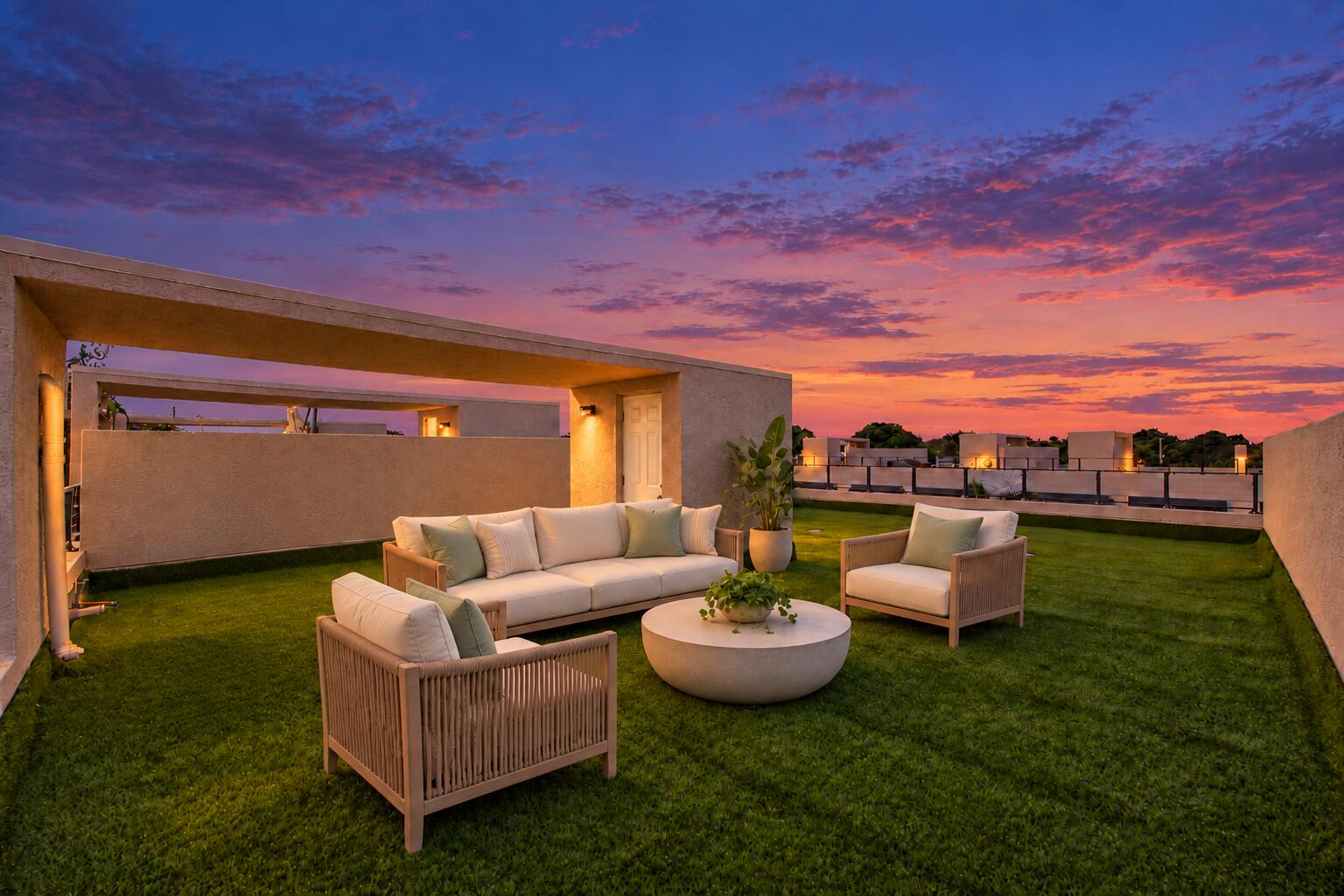 Expansive rooftop terrace featuring synthetic turf flooring, stucco-finished perimeter walls, and metal railings Expansive rooftop terrace featuring synthetic turf flooring, stucco-finished perimeter walls, and metal railings