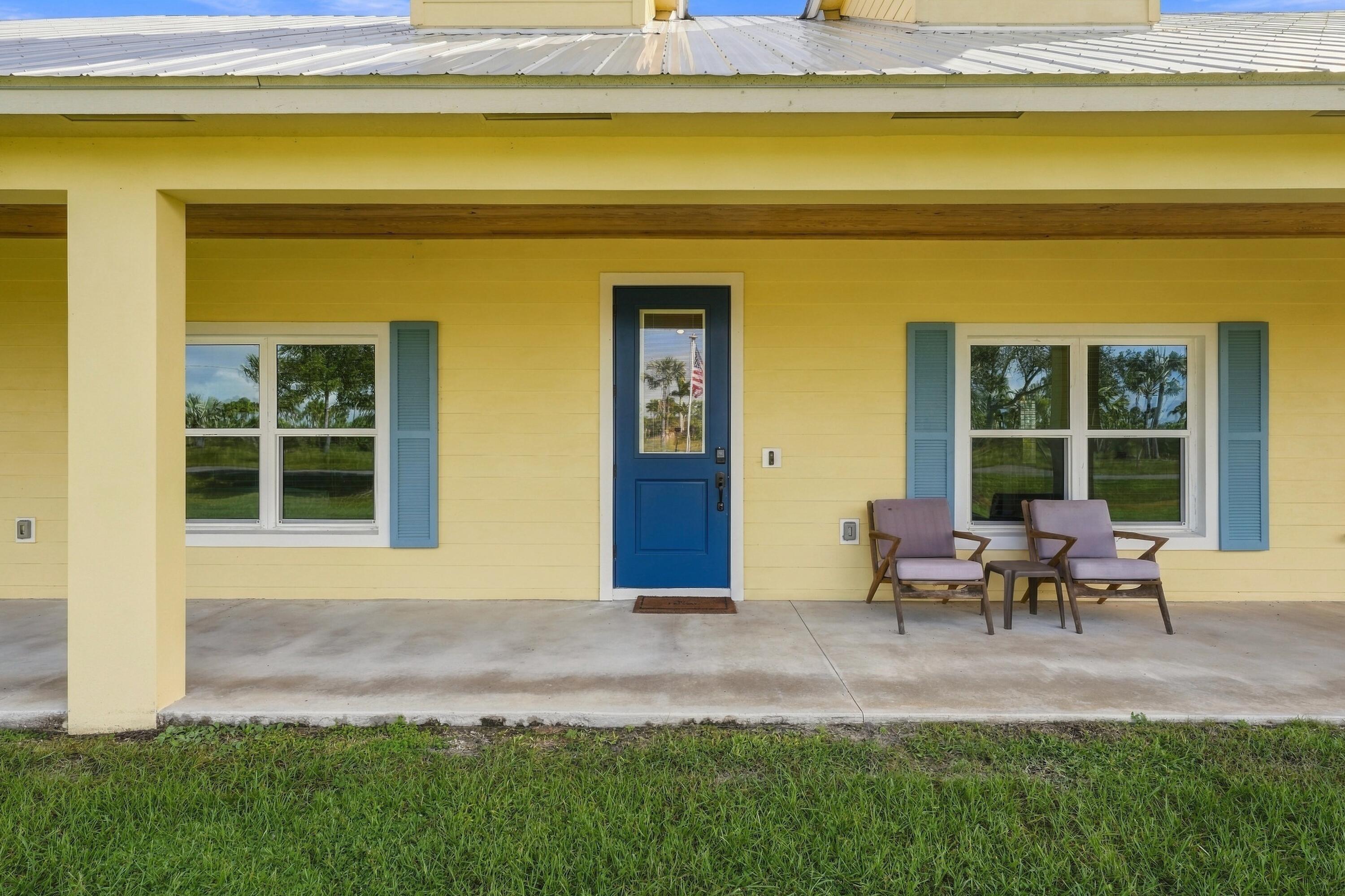 Charming Covered Porch with Seating