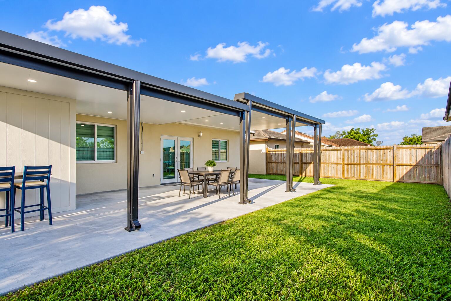 Modern Lanai in a Sunny Backyard