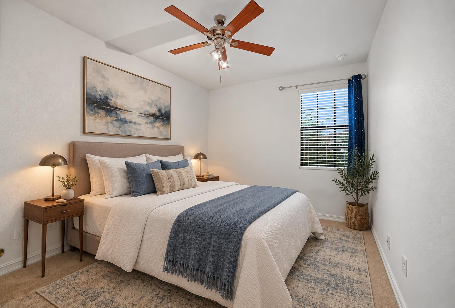 Neutral interior with a ceiling fan featuring integrated lighting and a window with horizontal blinds