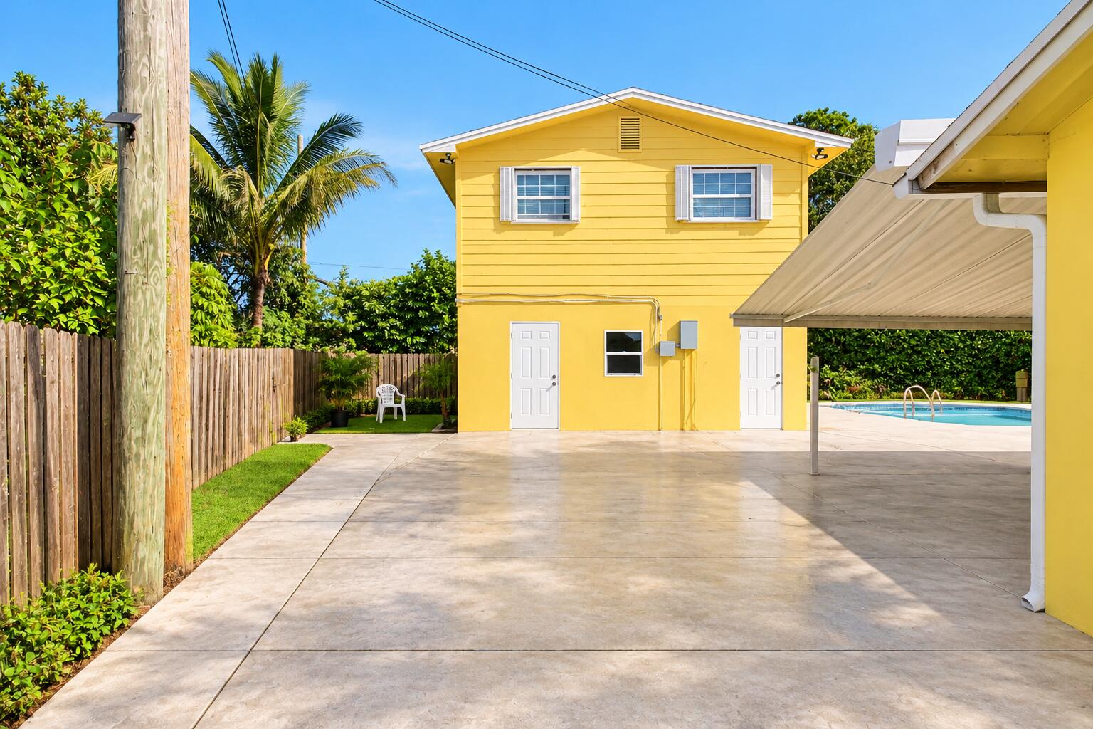 Sunny Yellow House with Tropical Yard Sunny Yellow House with Tropical Yard