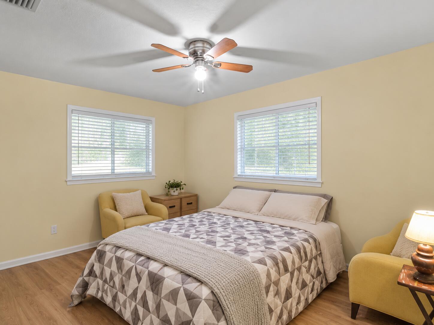 Decluttered bedroom with clean white bli Decluttered bedroom with clean white bli