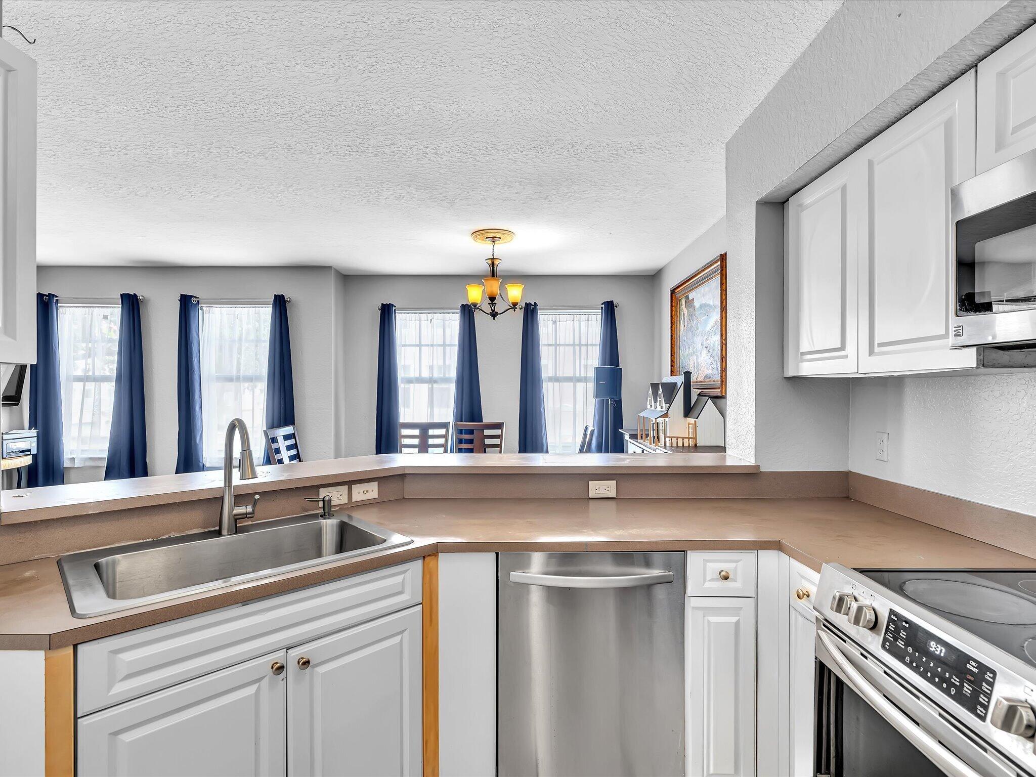 Kitchen looking at Dining Room and full of light
