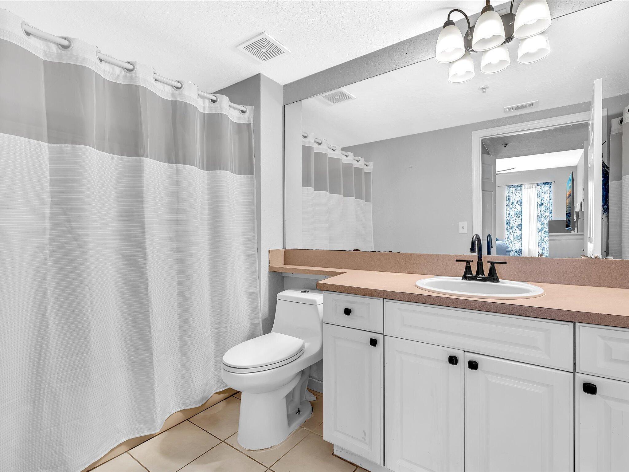 Primary Bathroom with tub on one side and shower in the opposite side