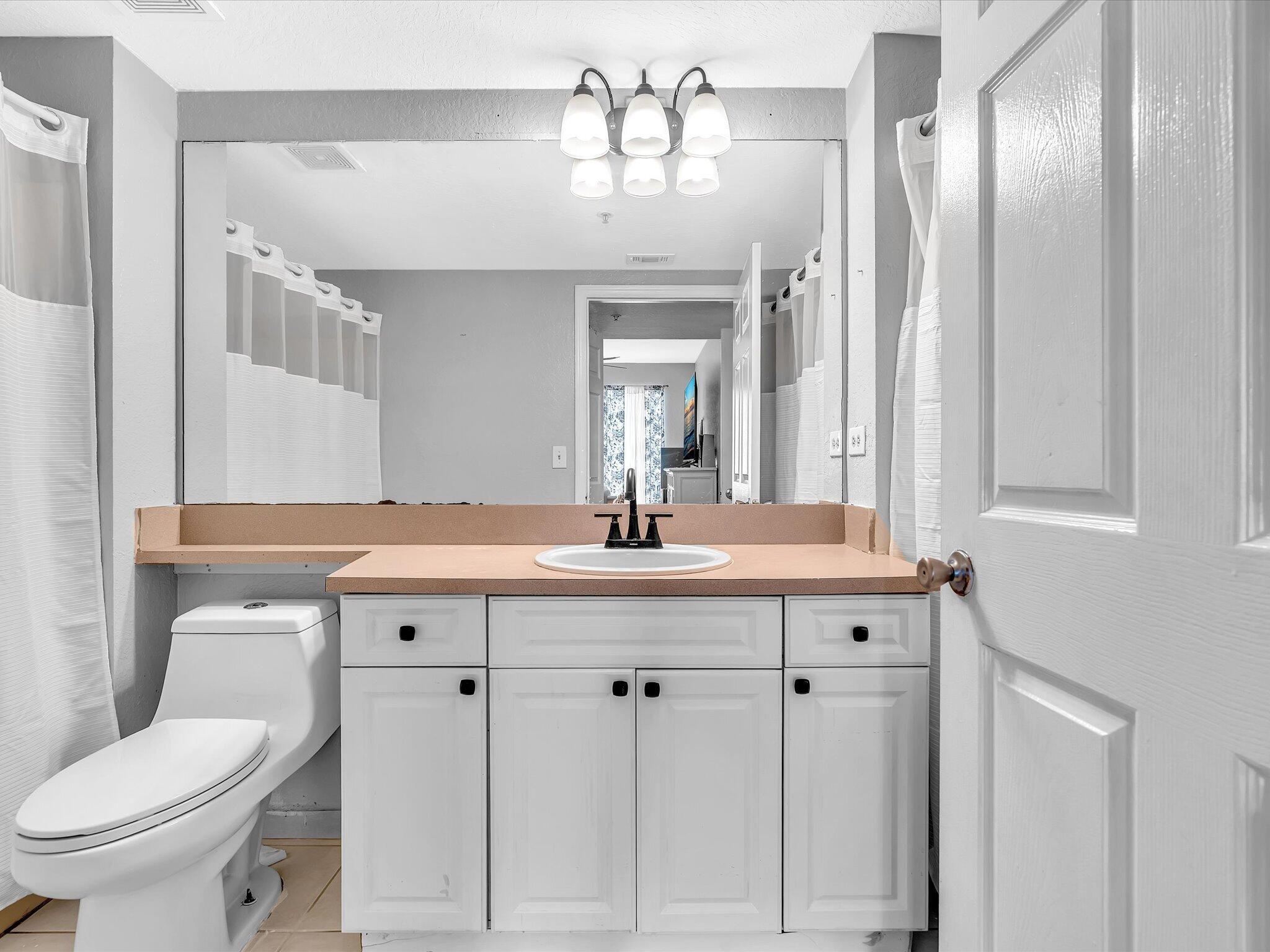 Primary Bathroom has tub on the left and shower on the right!