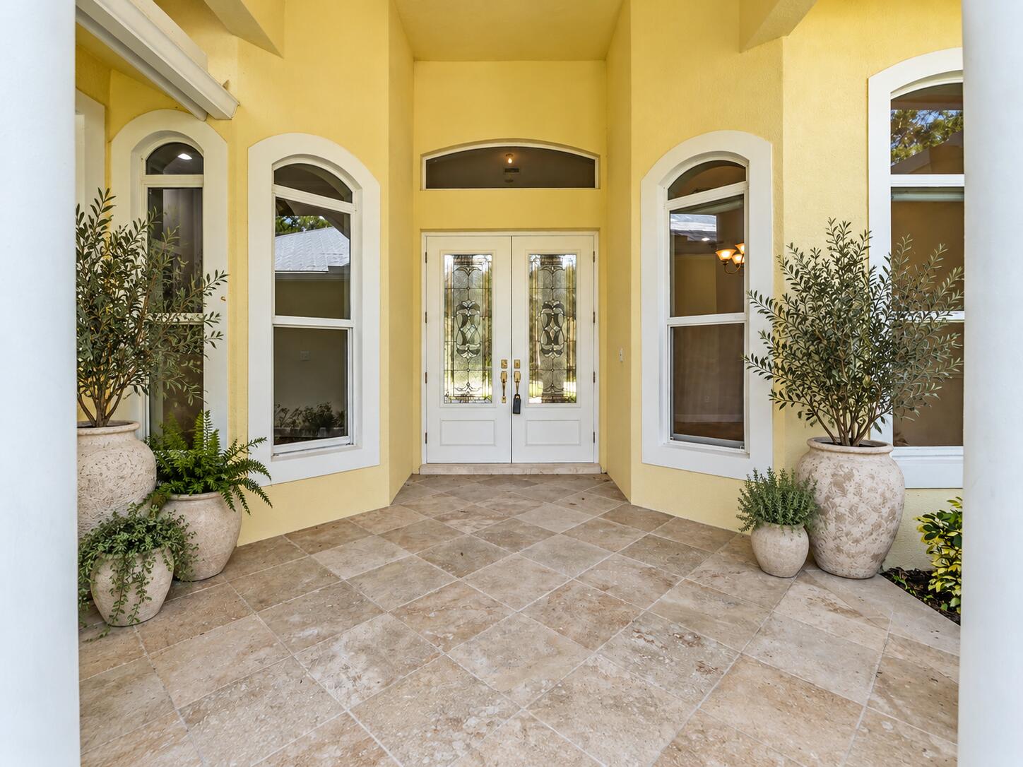 Mediterranean Entryway with Lush Planter