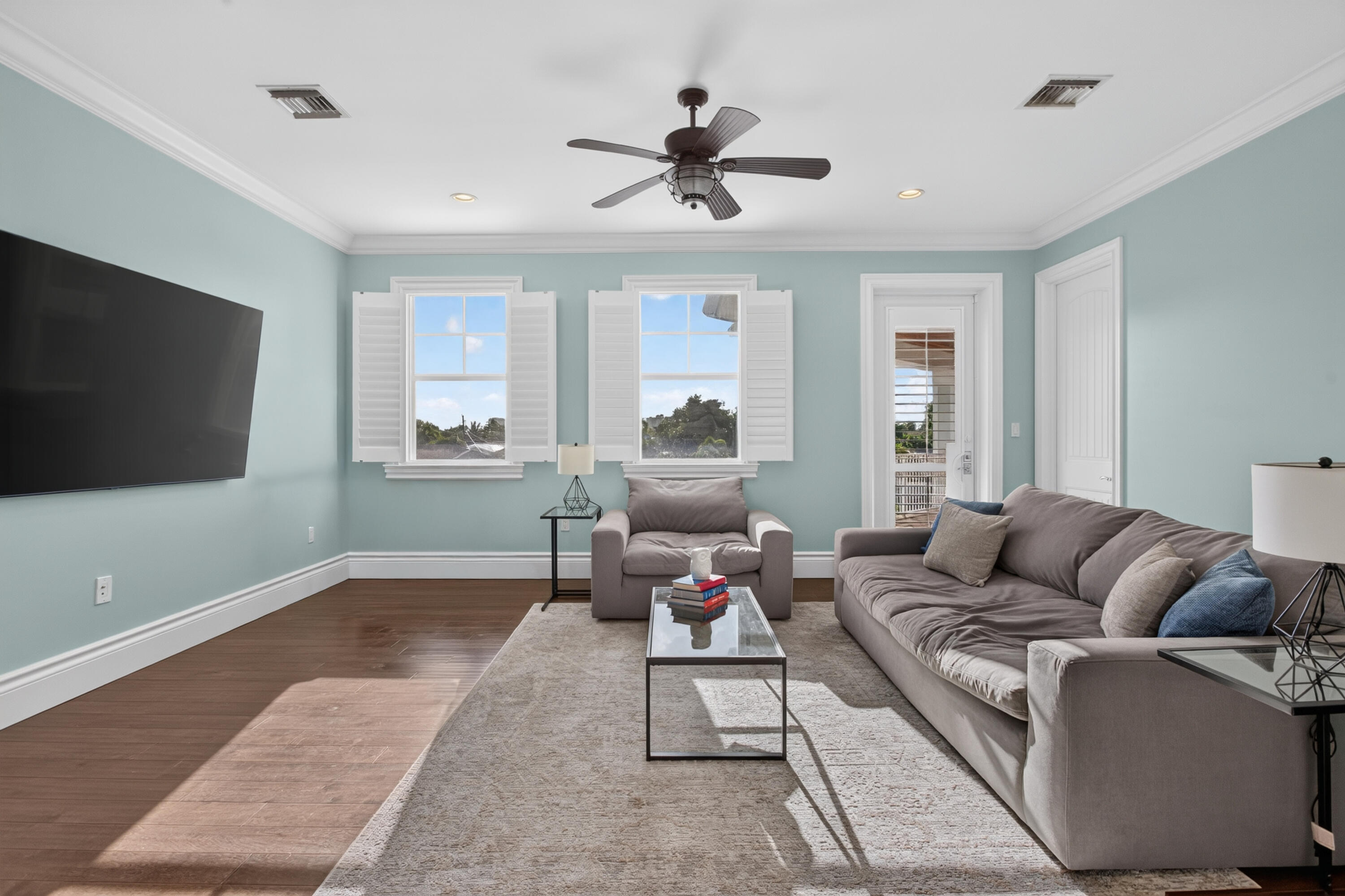 Beautiful natural light in upstairs loft with access to balcony.