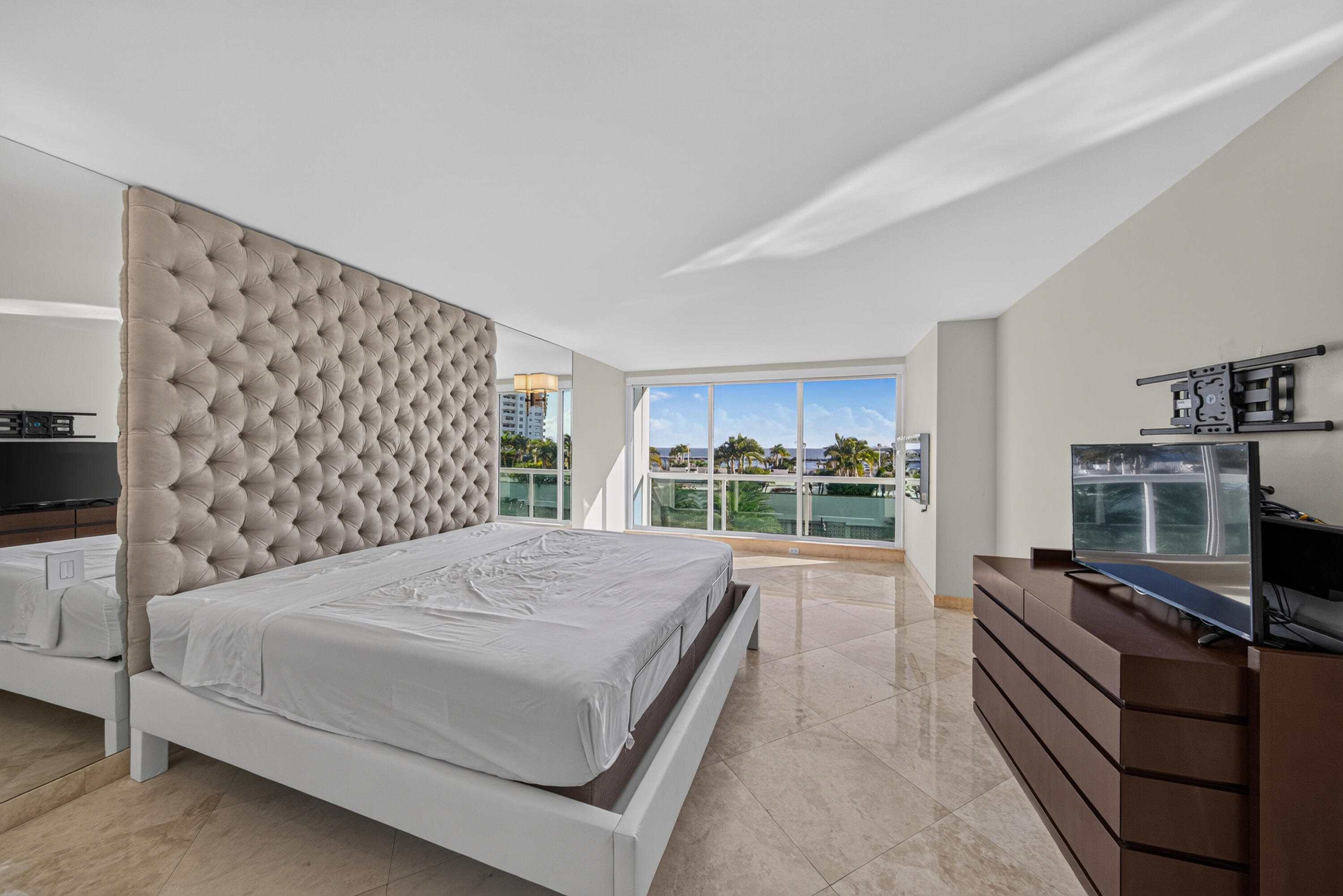 Main Residence - Primary Bedroom with electric blackout shade.