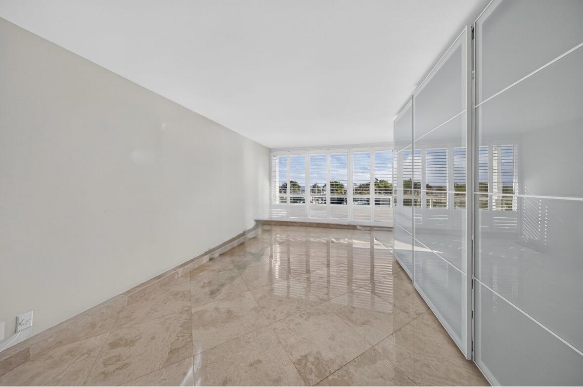 Main Residence - Guest Bedroom with walk-in closet, built-in closets and an additional closet.