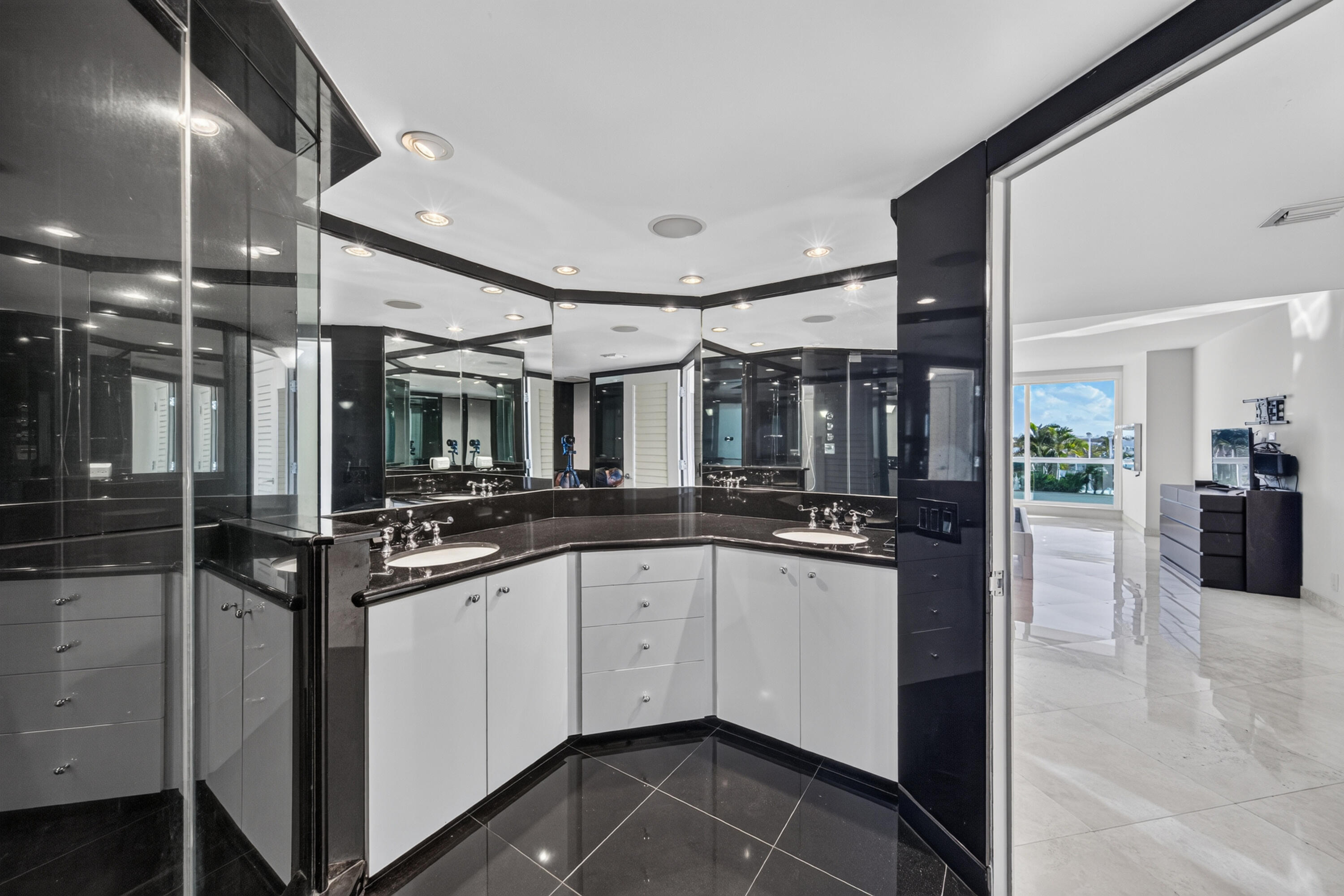 Main Residence - Primary bathroom with large shower and dual sinks.