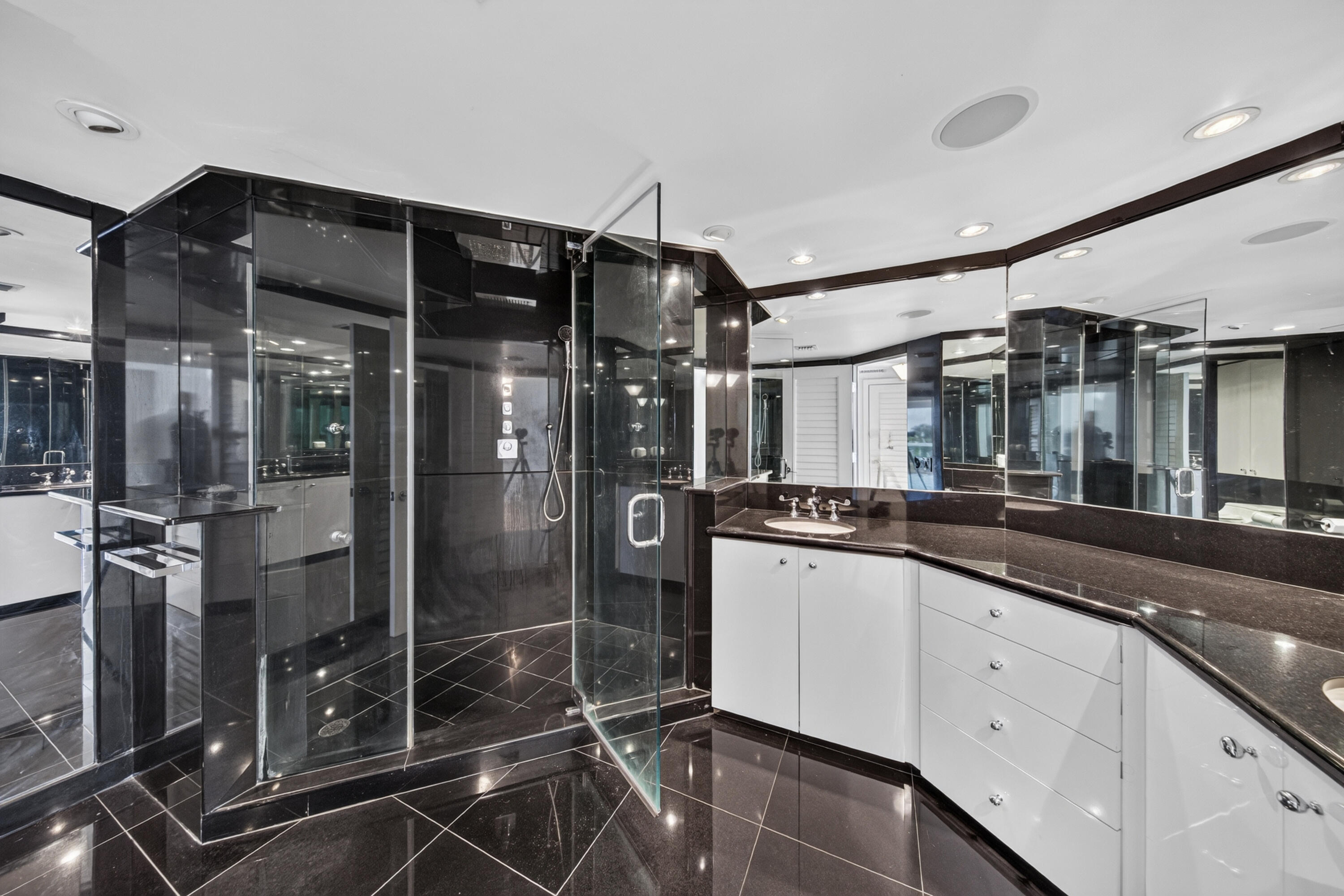 Main Residence - Primary bathroom with large shower and dual sinks.