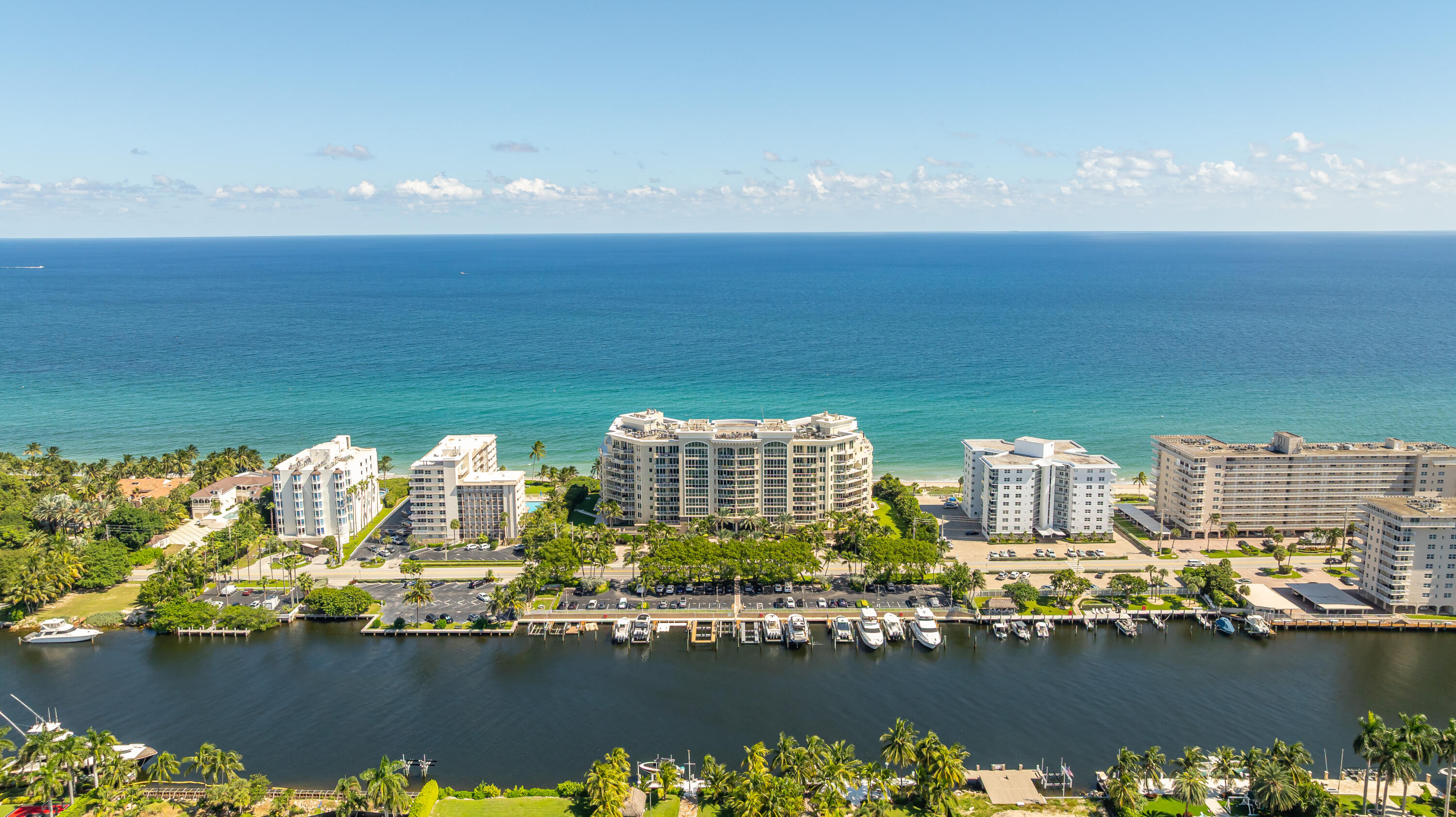 Ocean Grande at center photo nestled between the Atlantic ocean and A1A. The address referred to as Hillsboro Mile along this area. Famously know as Millionaire Mile.