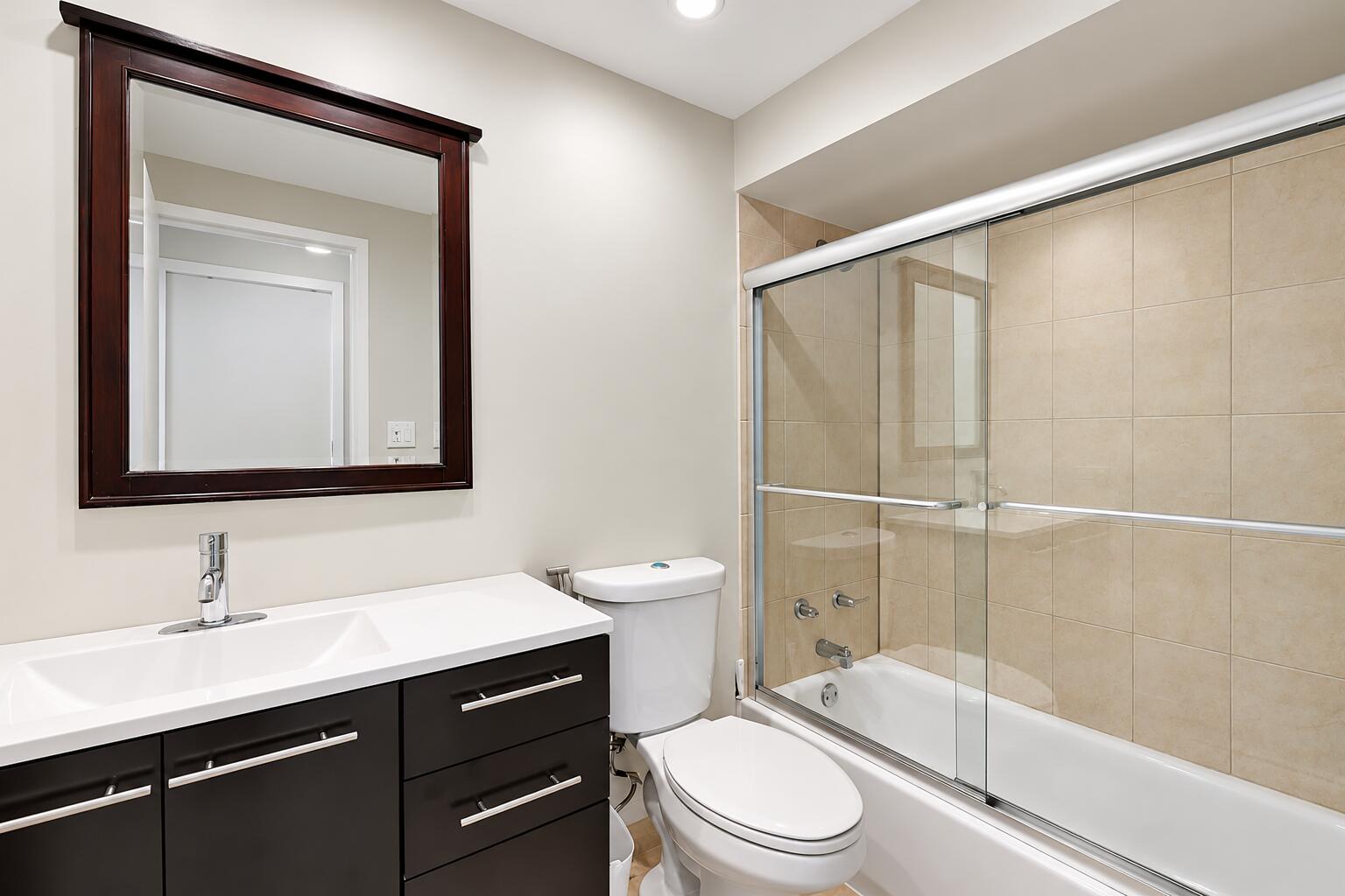 Modern Greige Bathroom with Glass Shower