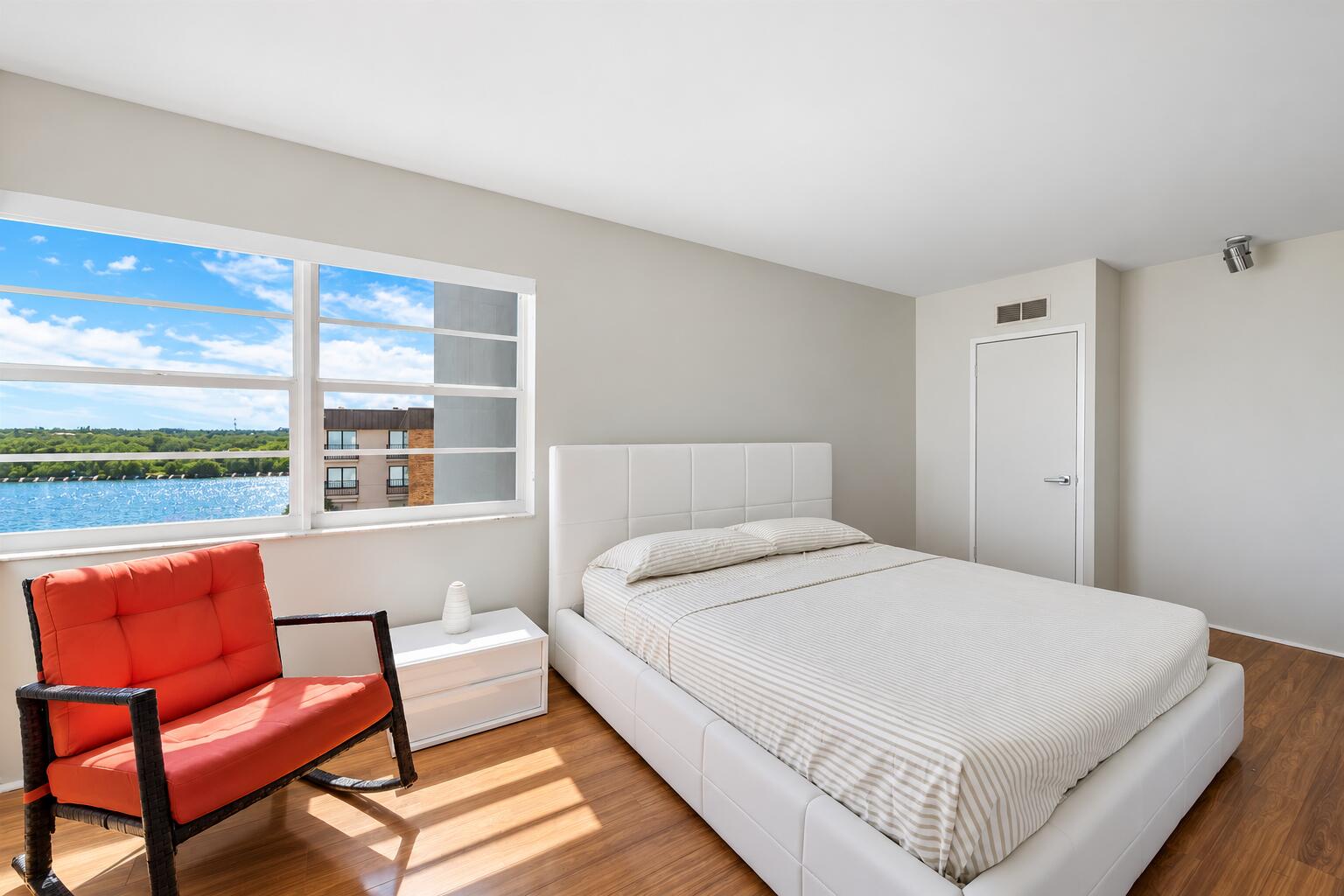 Waterfront Bedroom with Terracotta Chair