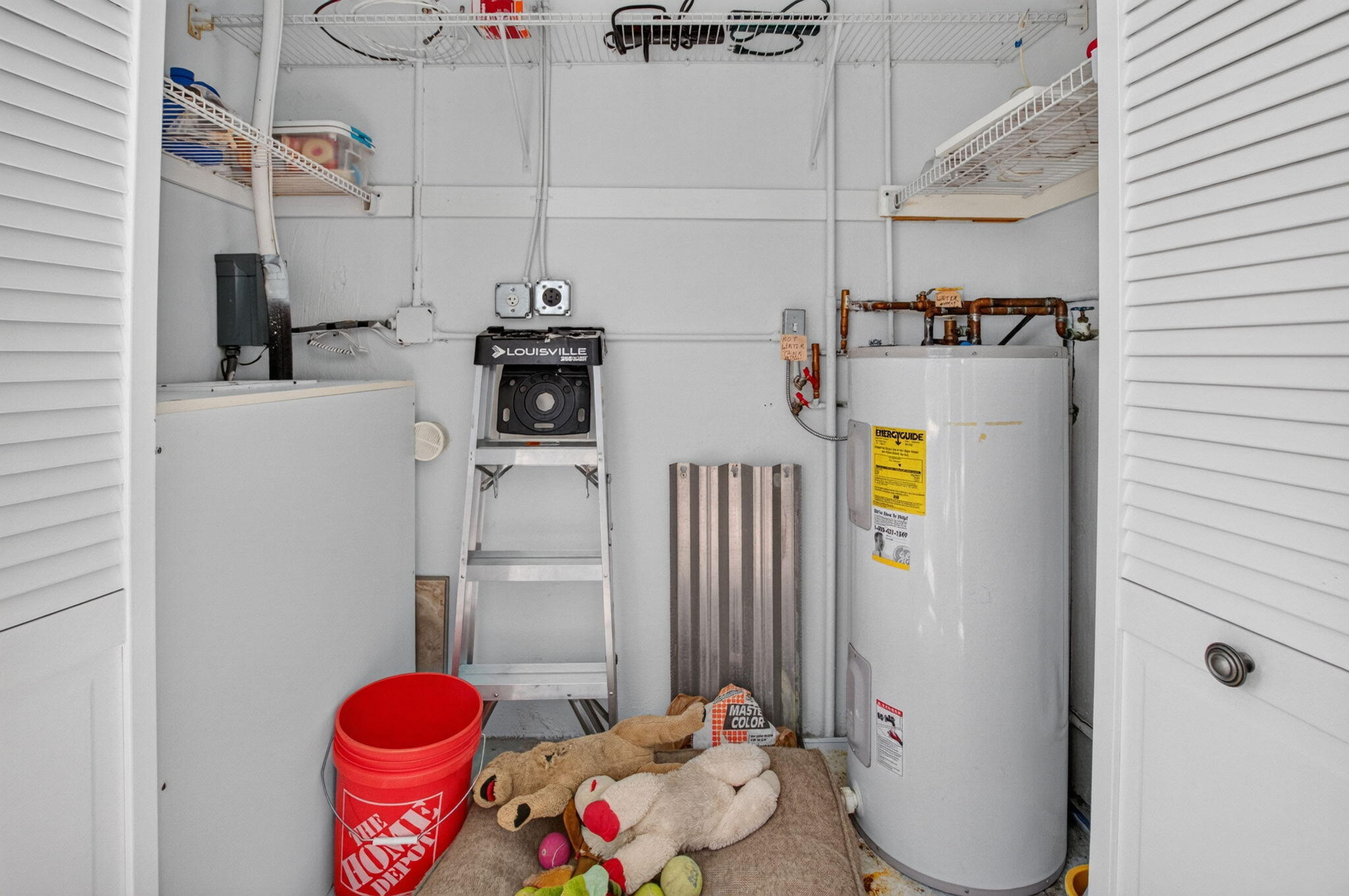 Utility Closet with washer dryer hook up and extra storage