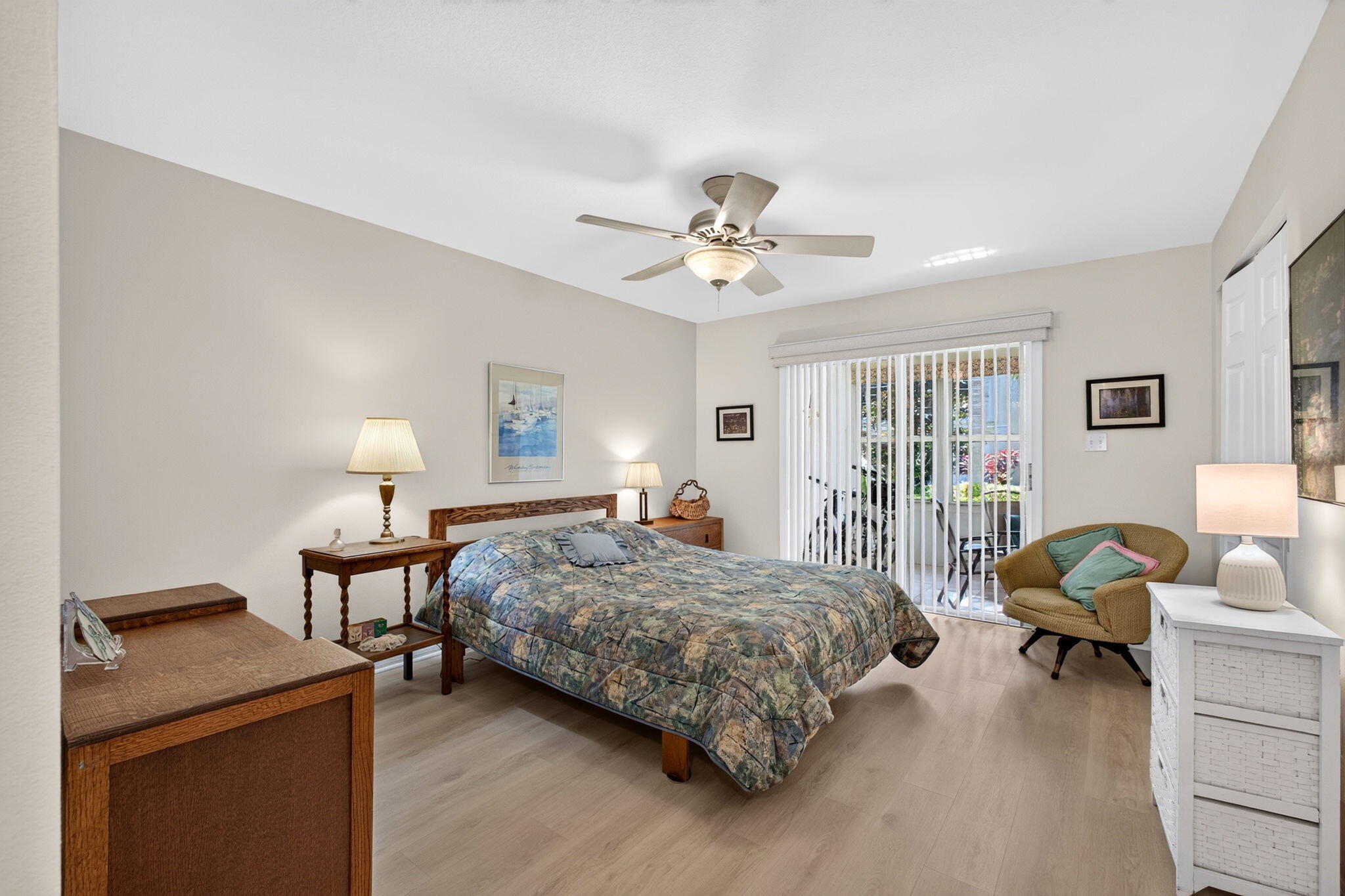 Spacious primary bedroom with plenty of natural light
