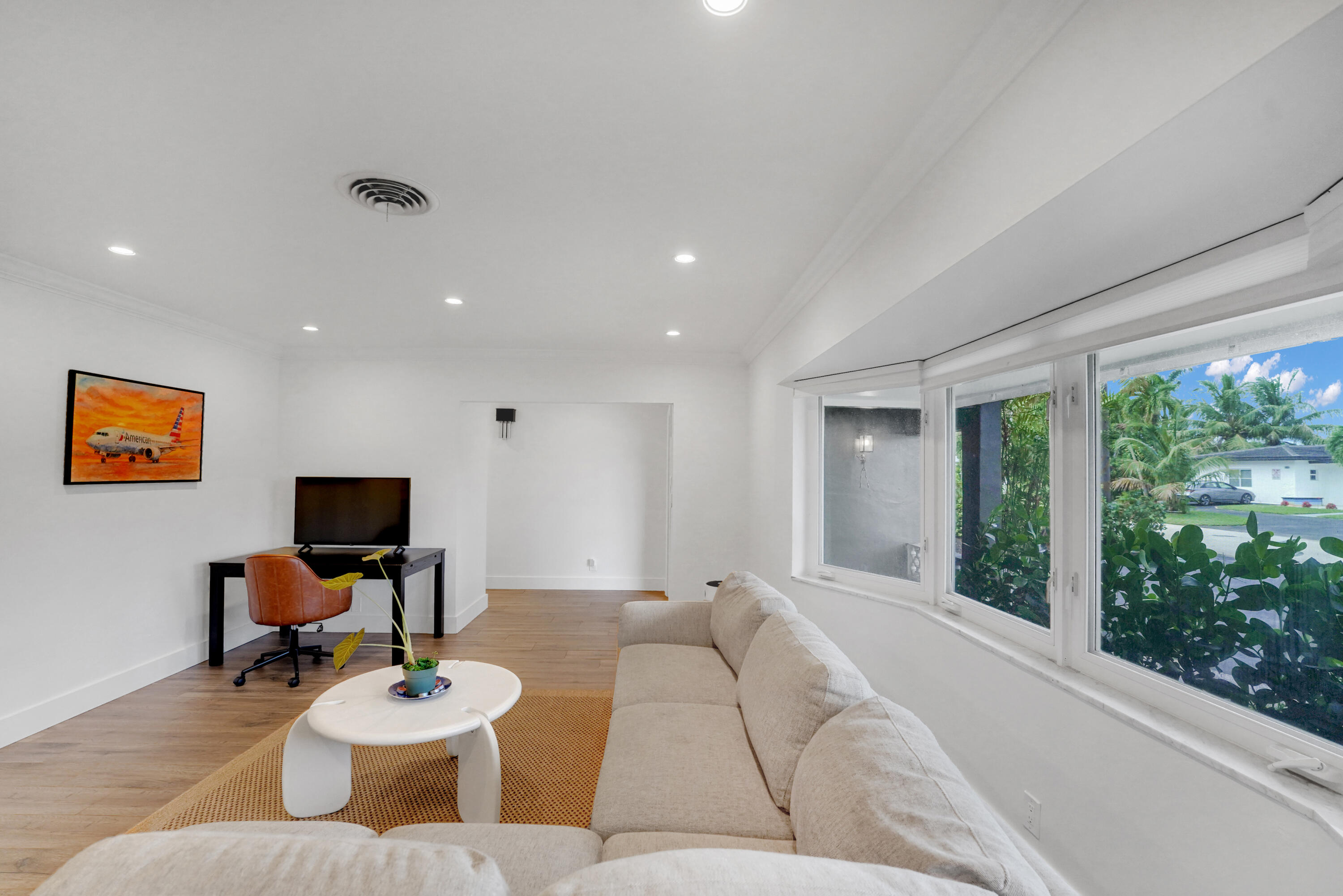 Living area featuring recessed lighting, and a multi-pane bay window