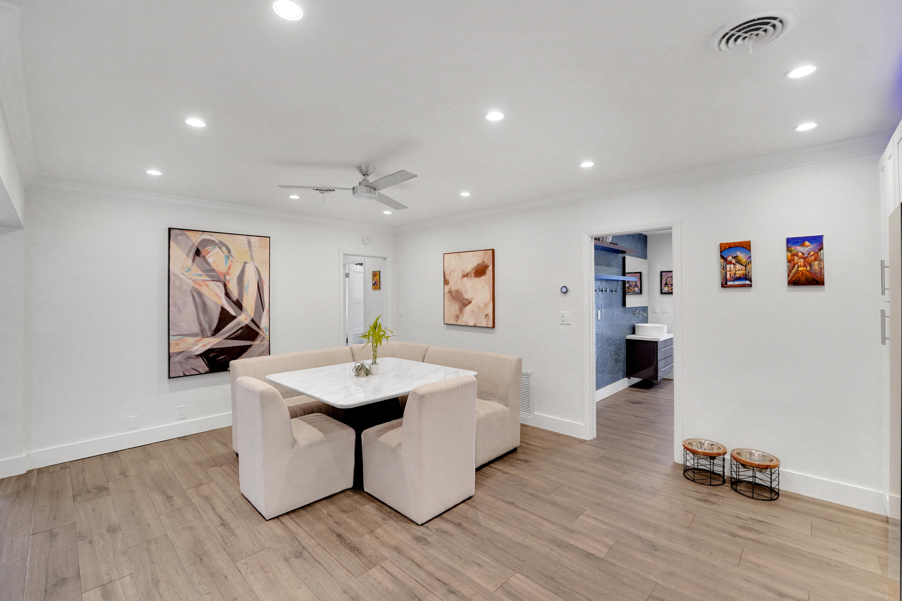 Wood-finish flooring, recessed lighting, and a modern ceiling fan