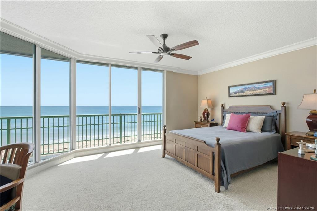 Oceanfront primary suite offers panoramic water views, abundant natural light, and plenty of room to relax.