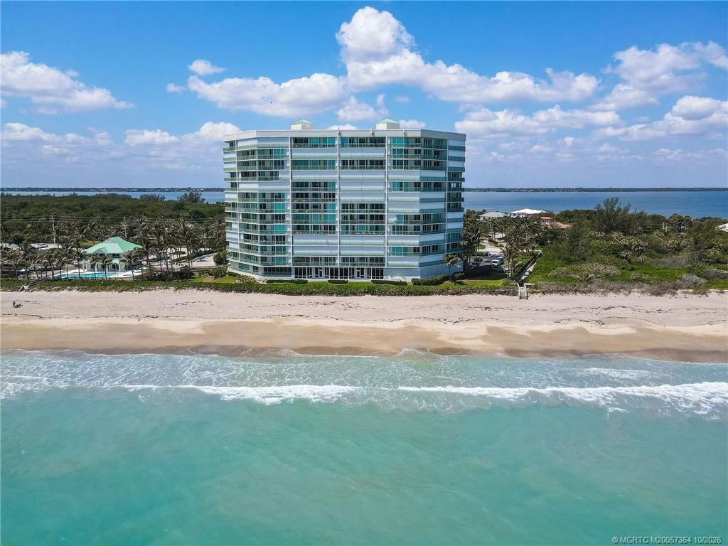 Stunning aerial view of Regency Island Dunes, perfectly positioned along the pristine beaches of Hutchinson Island with the Intracoastal Waterway to the west.