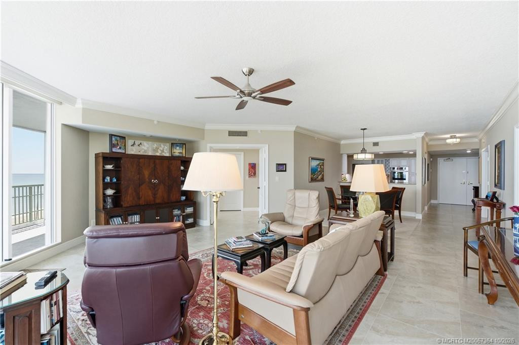 Spacious dining area flows seamlessly into the living room, with stunning ocean views as the backdrop.