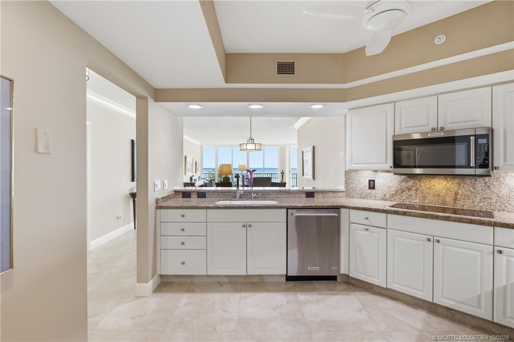 Enjoy ocean views from the kitchen, which opens to the dining and living areas for easy entertaining.