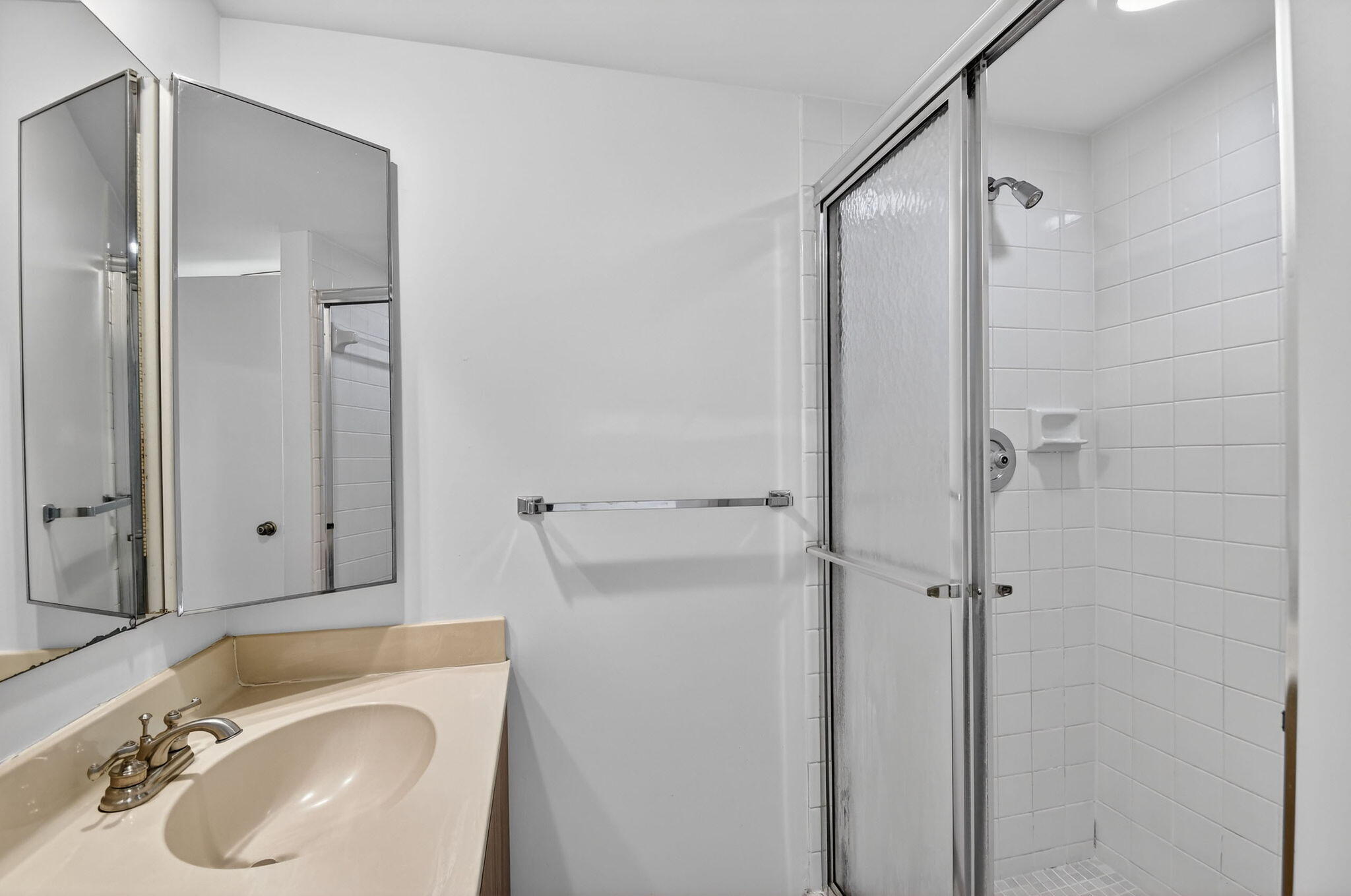 Primary bathroom has step in shower