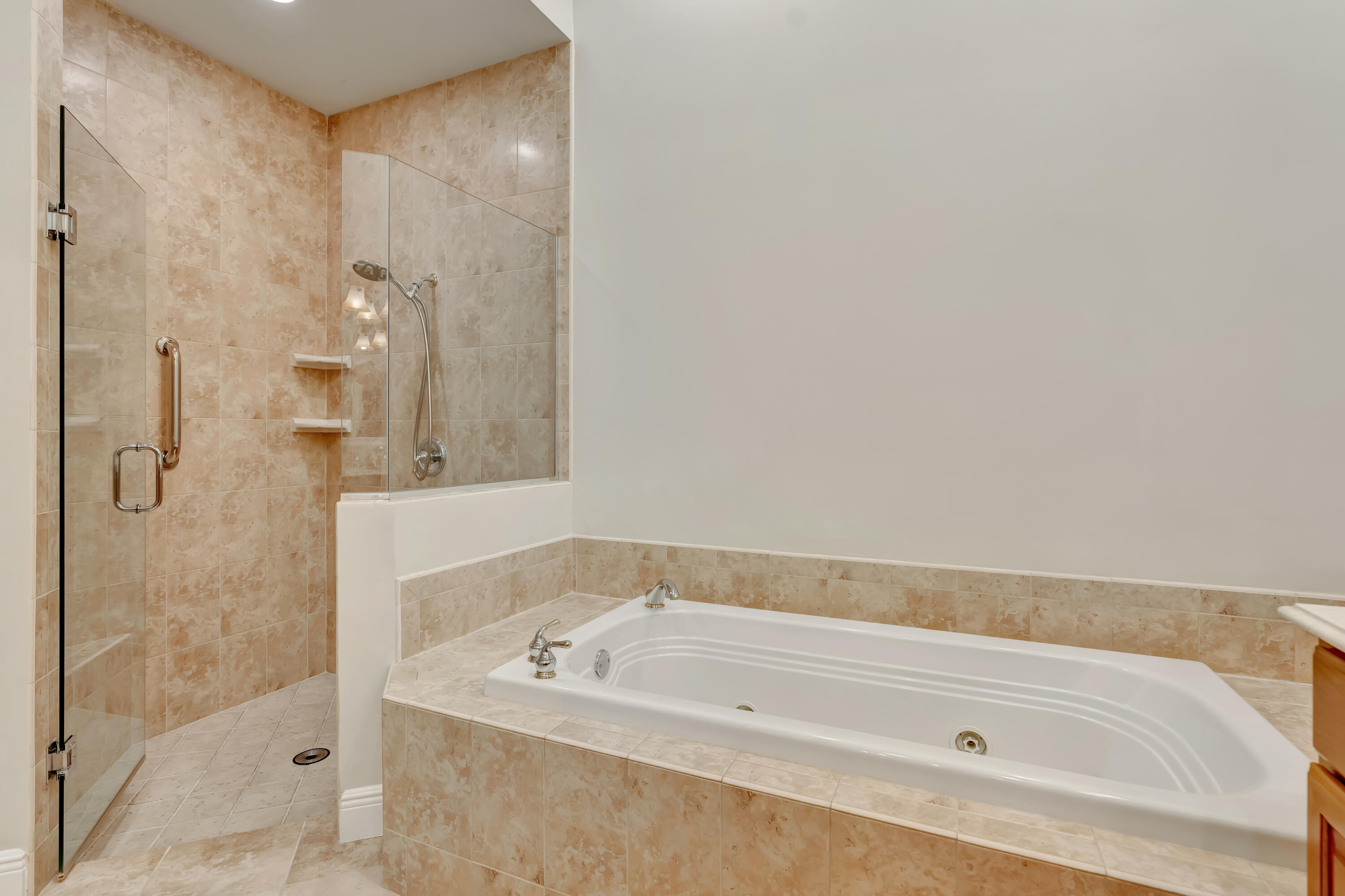 spacious master/primary jacuzzi tub and walk in shower